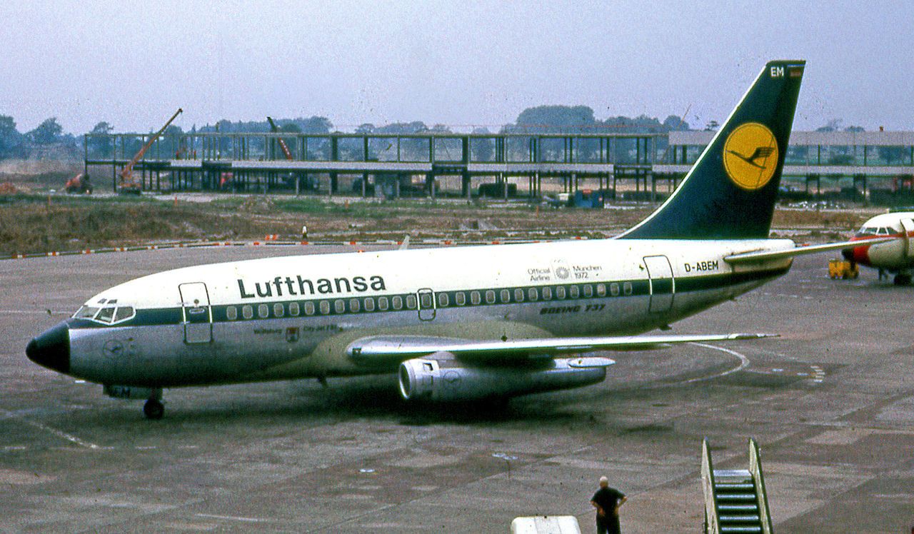 A Lufthansa Boeing 737-100 on an airport apron.