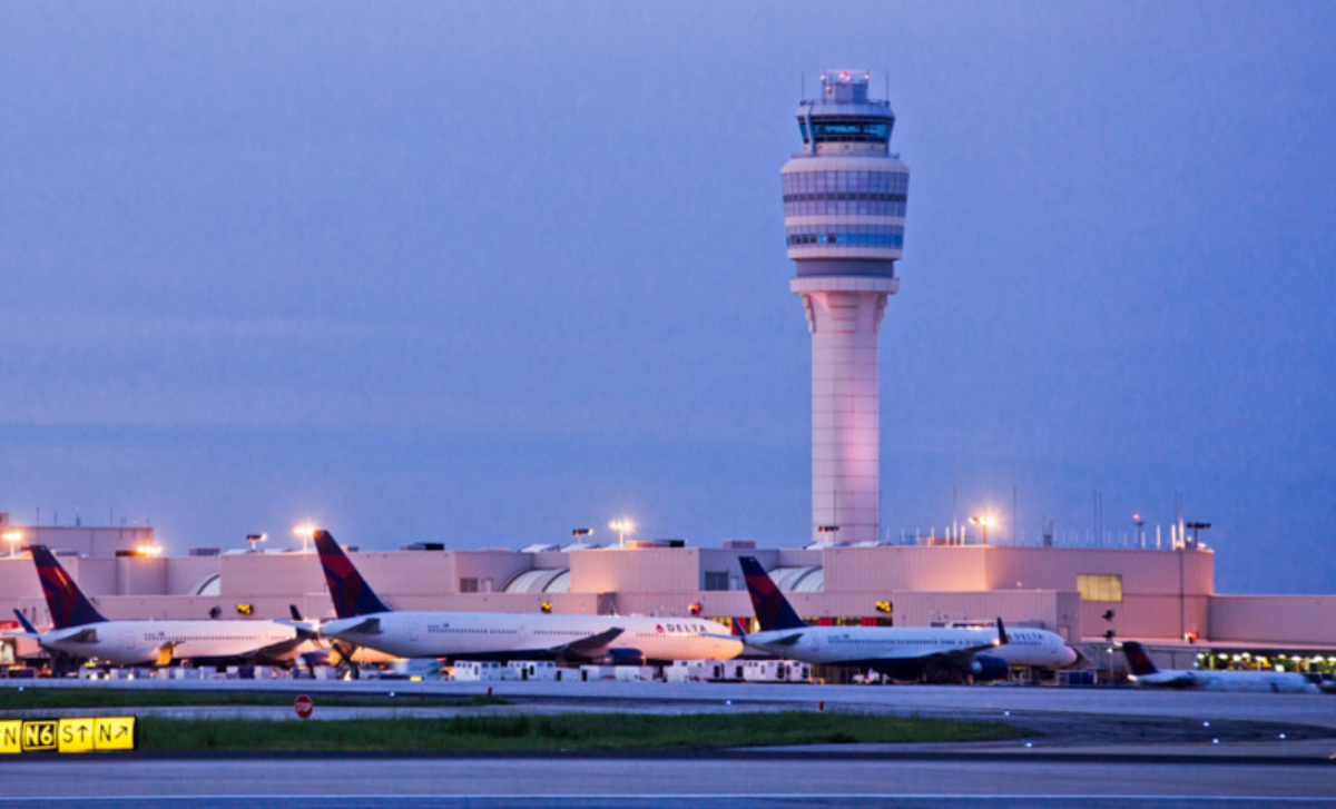 Outside view of Hartsfield-Jackson International Airport with many Delta Air Lines aircraft lined up.