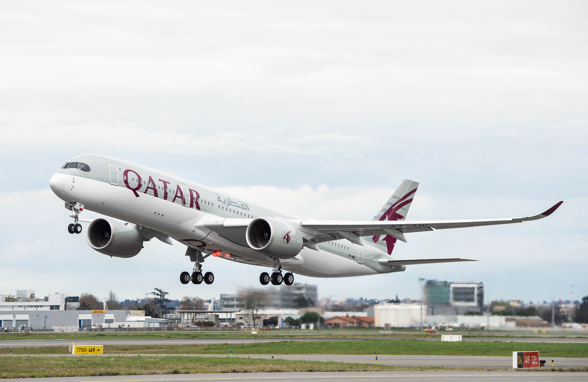 Qatar Airways Airbus A350-900 against blue sky