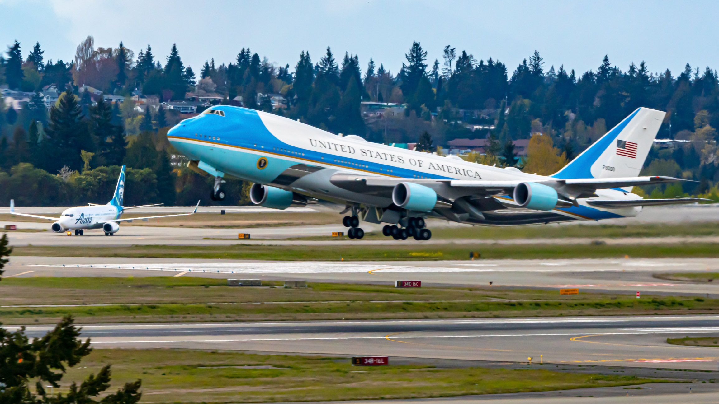Air Force One Lifting Past An Alaska Airlines Boeing 737-790 at Seattle-Tacoma International Airport
