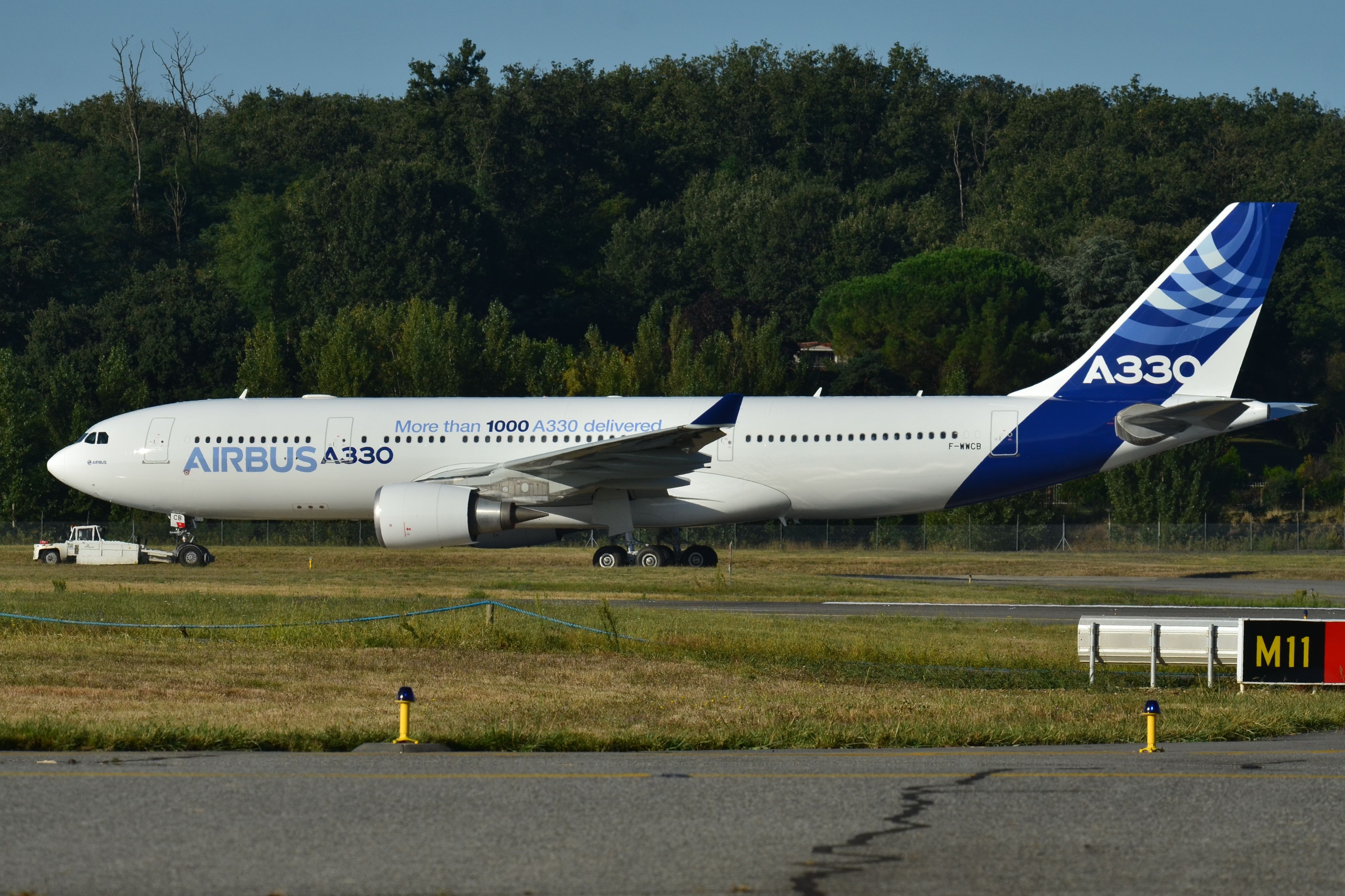 An Airbus A330-200 in house livery about to take off from Toulouse-Blagnac Airport.