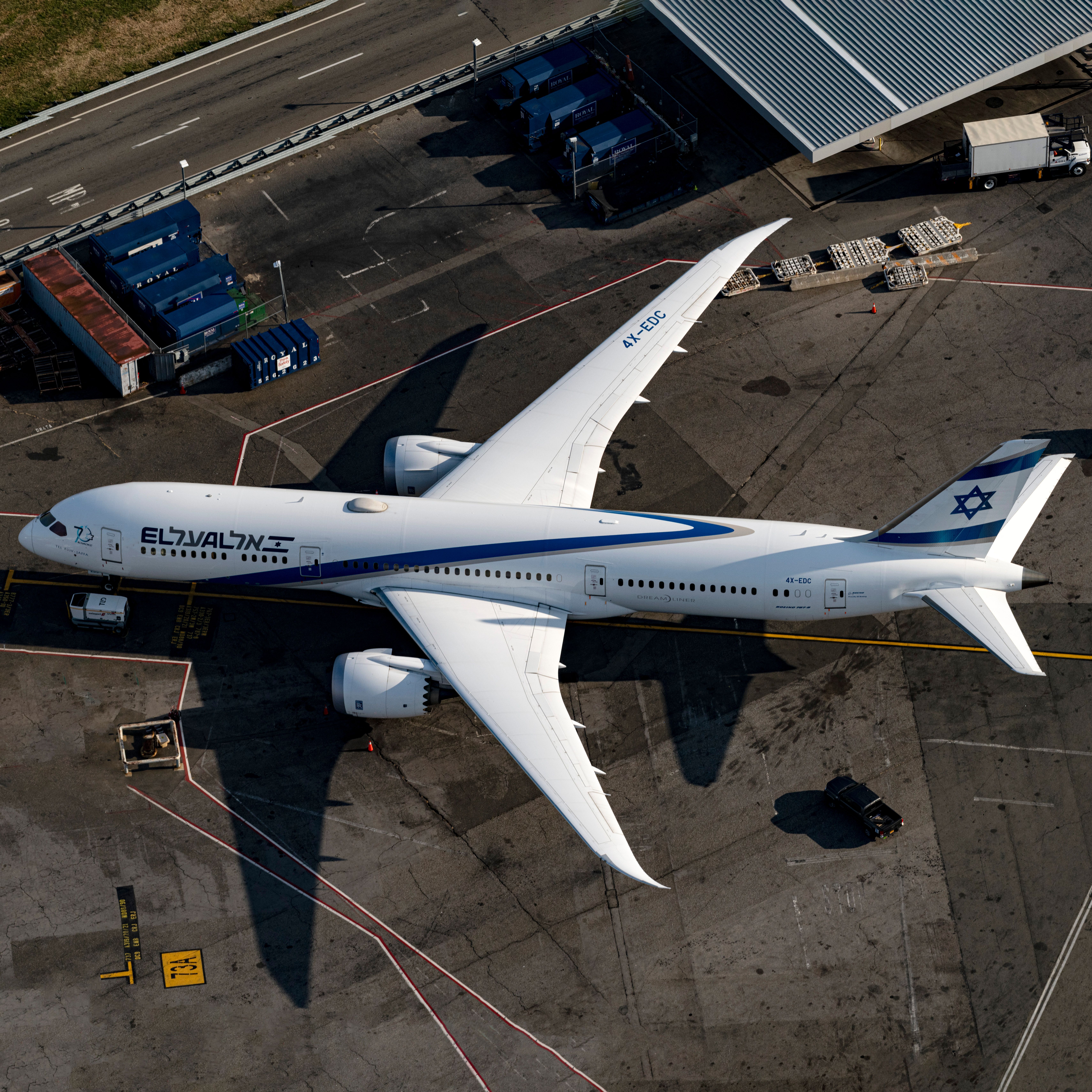 An El Al Israel Airlines Boeing 787-9 Dreamliner parked at a remote stand at JFK.