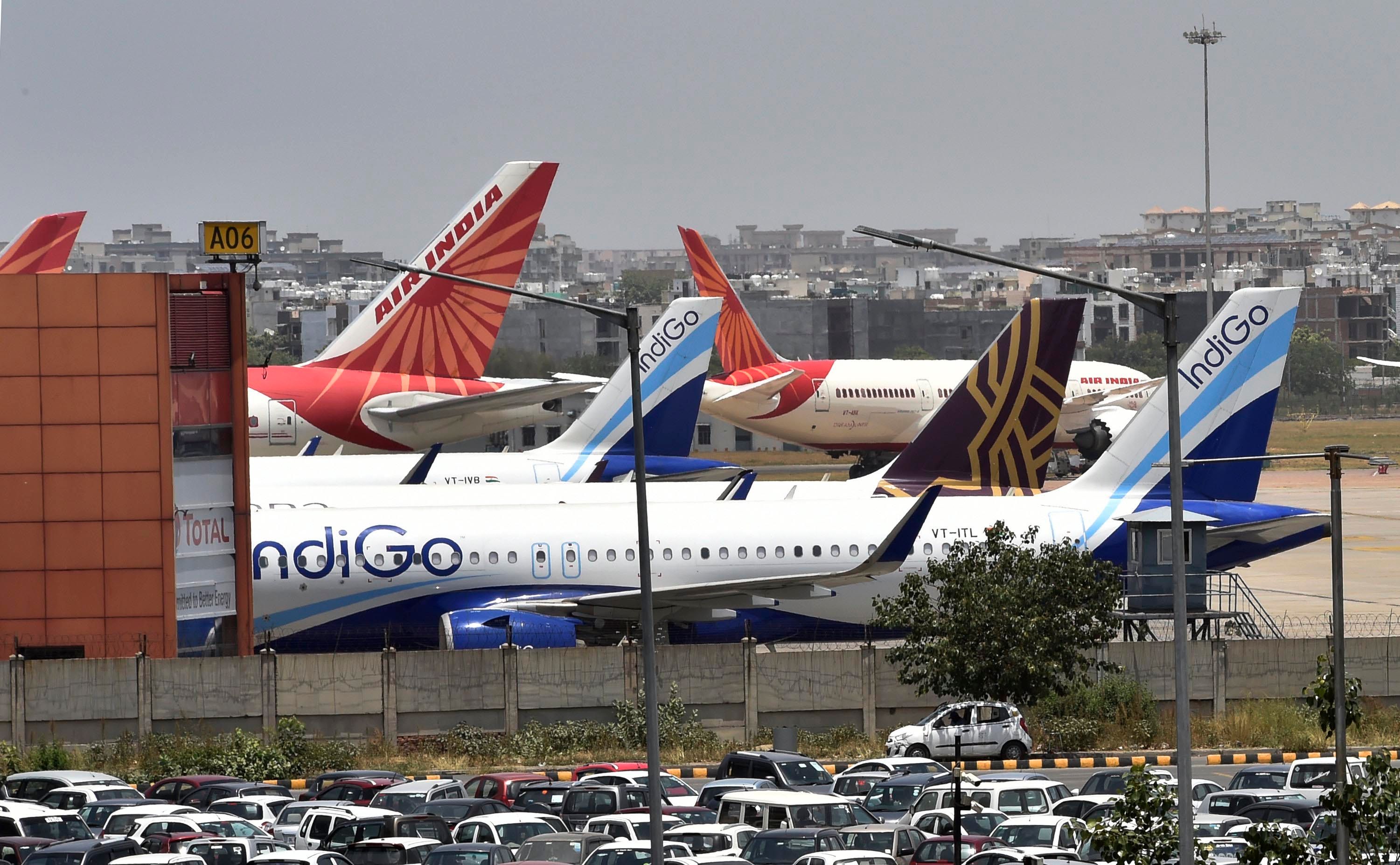 Tails of Indian planes in the parking lot at Delhi Airport 