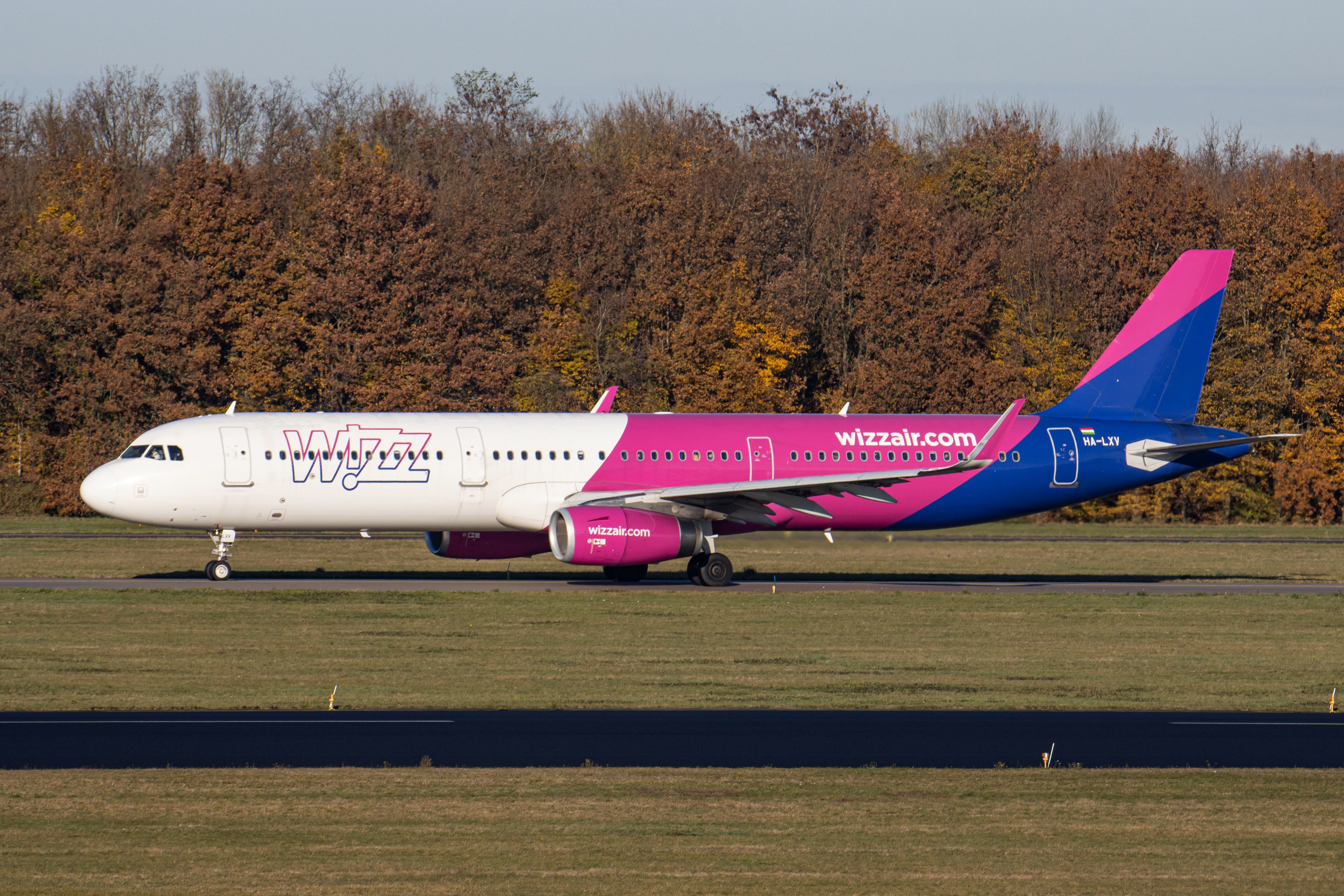 Wizz Air aircraft in front of trees