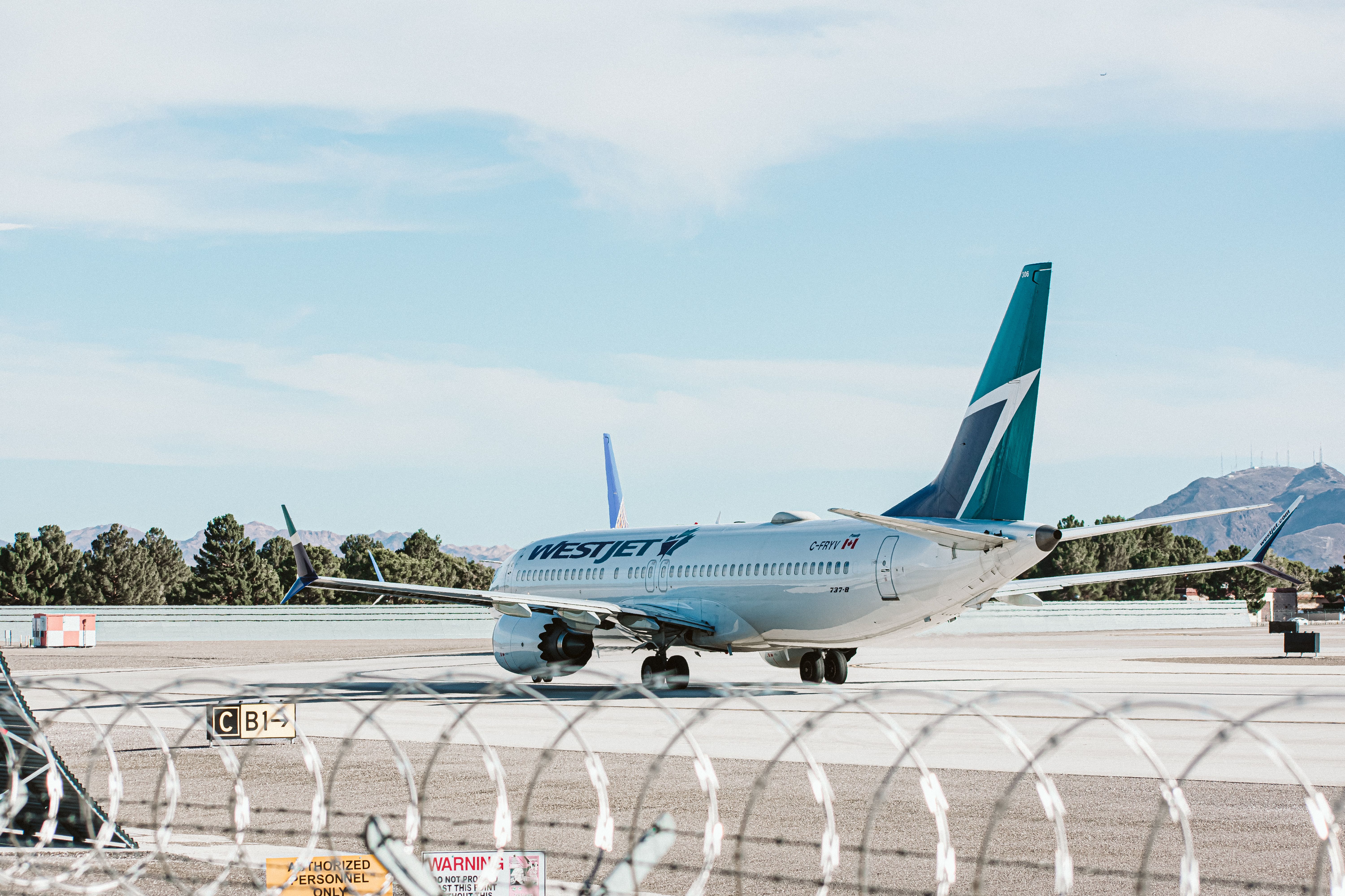 WestJet Boeing 737MAX8 taxiing for departure at LAS