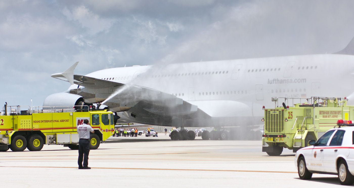 A Lufthansa Airbus A380 receiving a water salute.