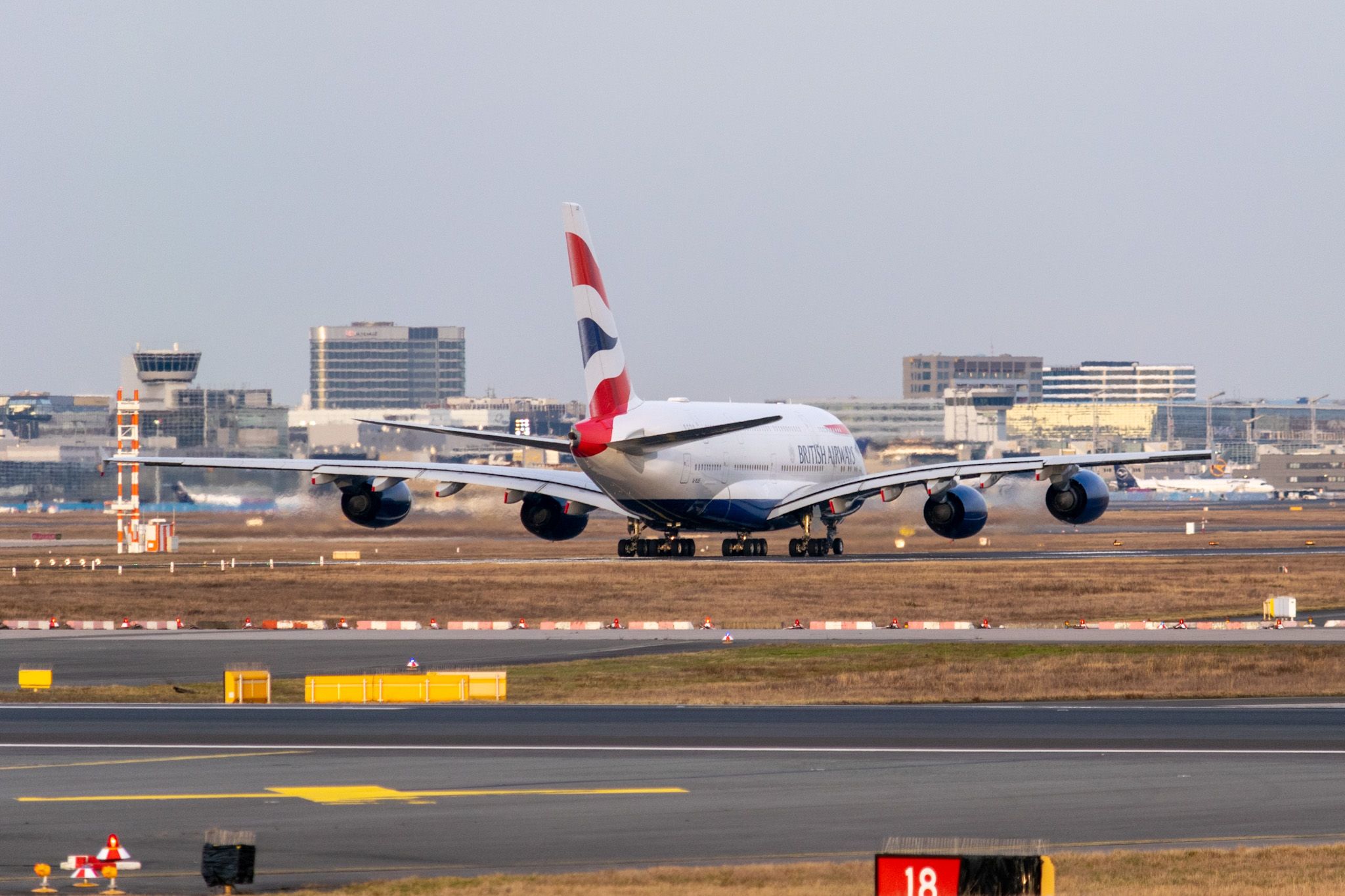 A British Airways Airbus A380 on an airport apron.