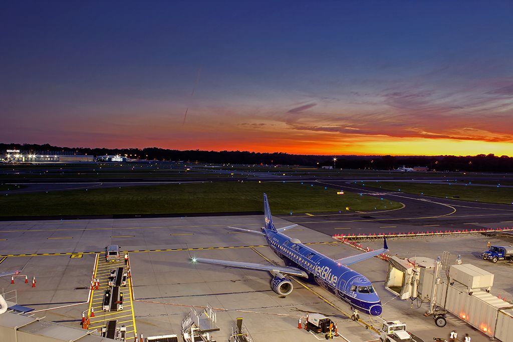 A beautiful summer sunset as JetBlue 695 to Orlando prepares to push back for the last departure of the day.
