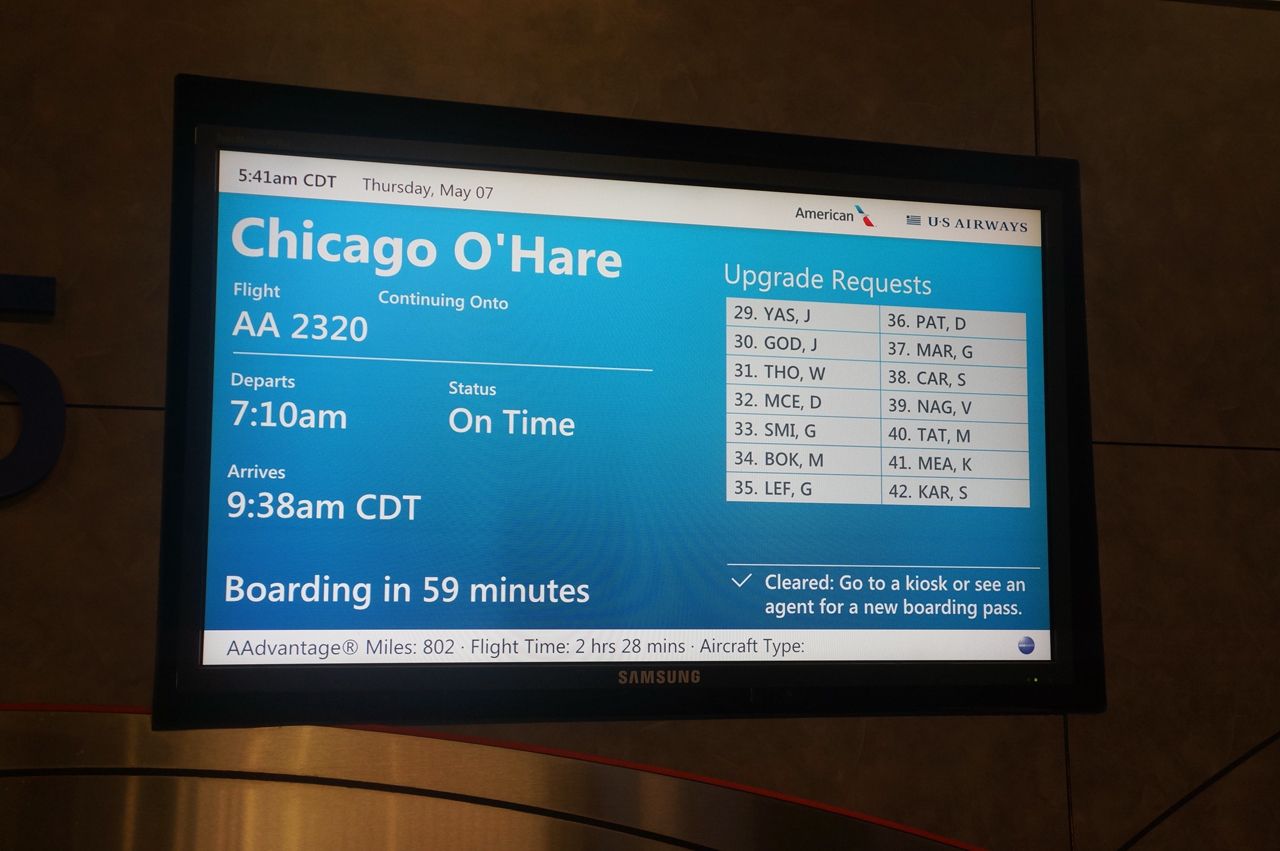 A photo of the screen at the gate for an American Airlines flight.