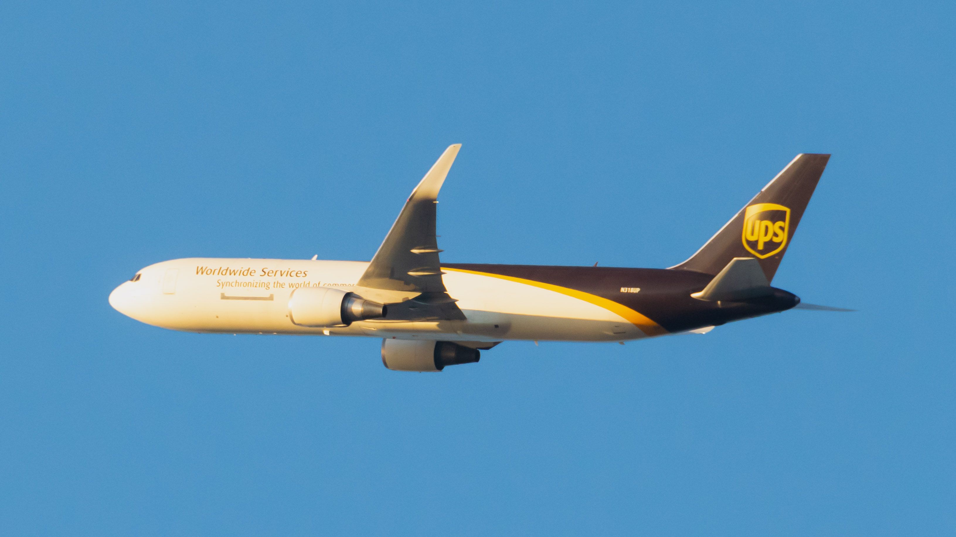 UPS BOEING 767 RISING INTO THE EVENING LIGHT