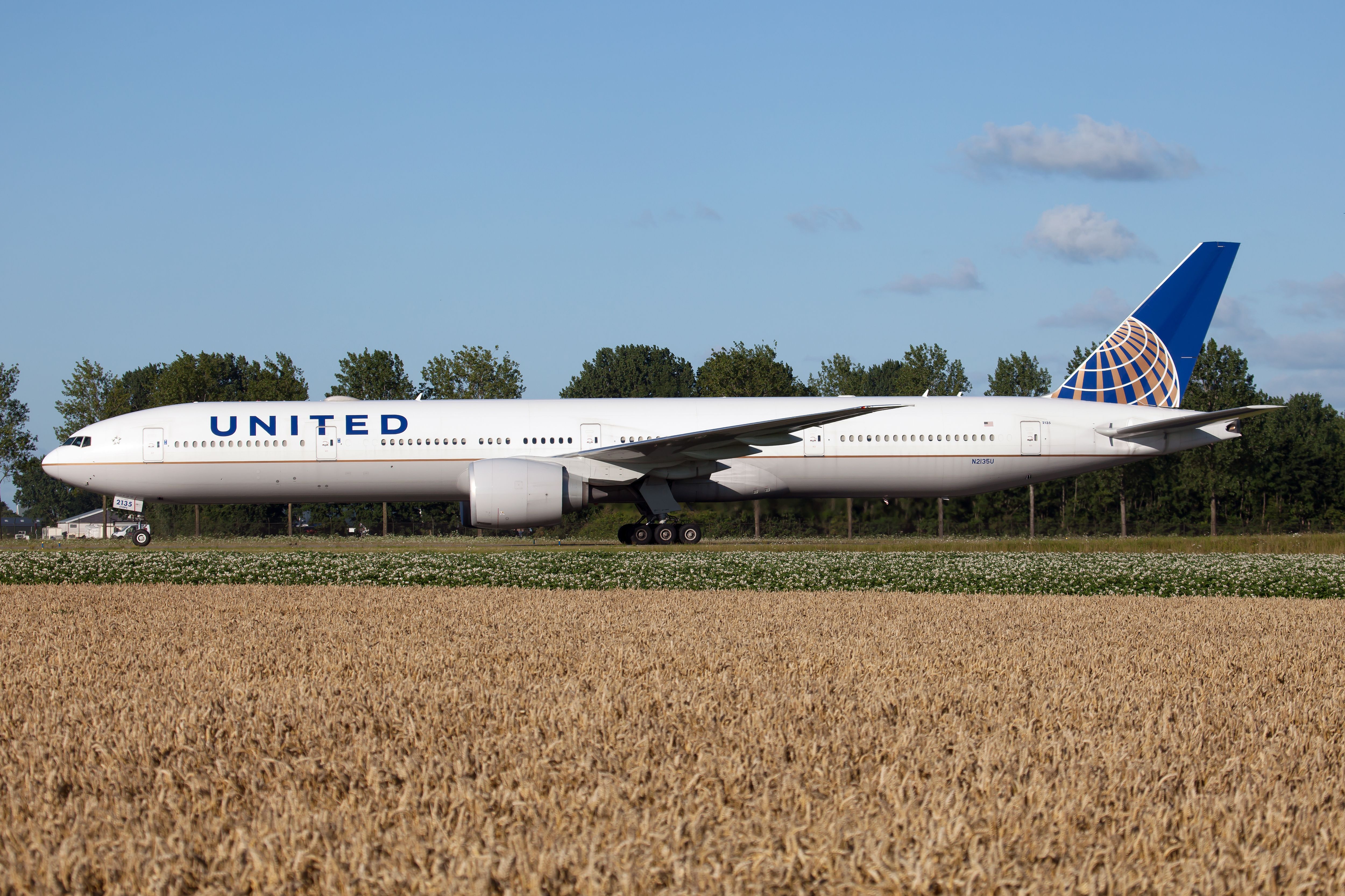 United Airlines Boeing 777-300ER on runway Amsterdam Schiphol