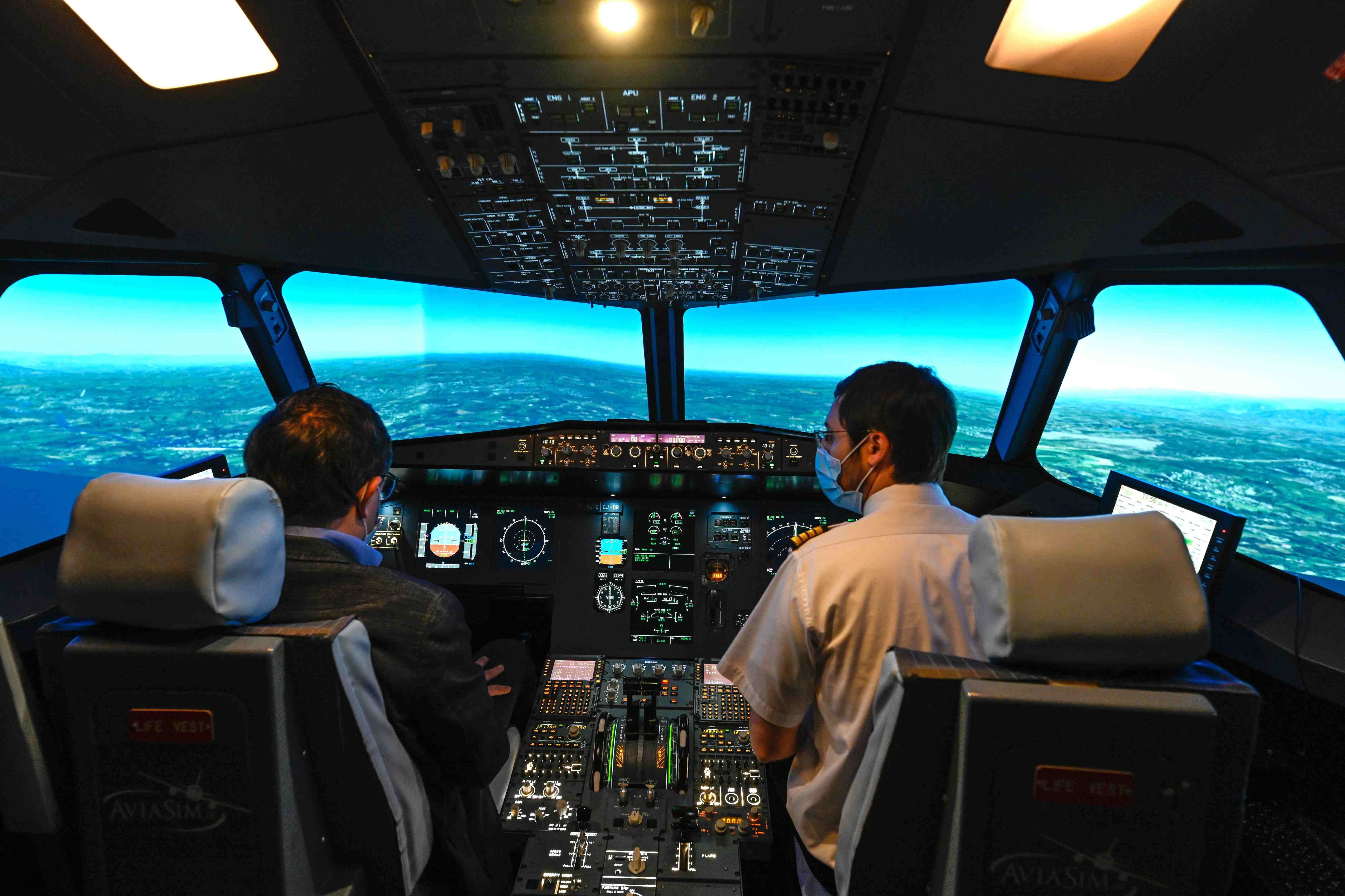 Pilots in flight simulator 