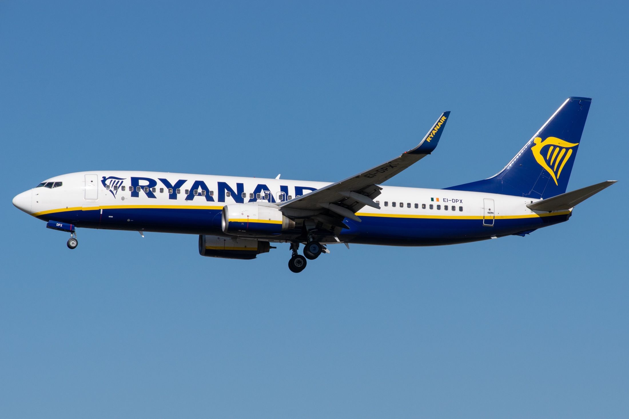 A Ryanair Boeing 737 flying in the sky.