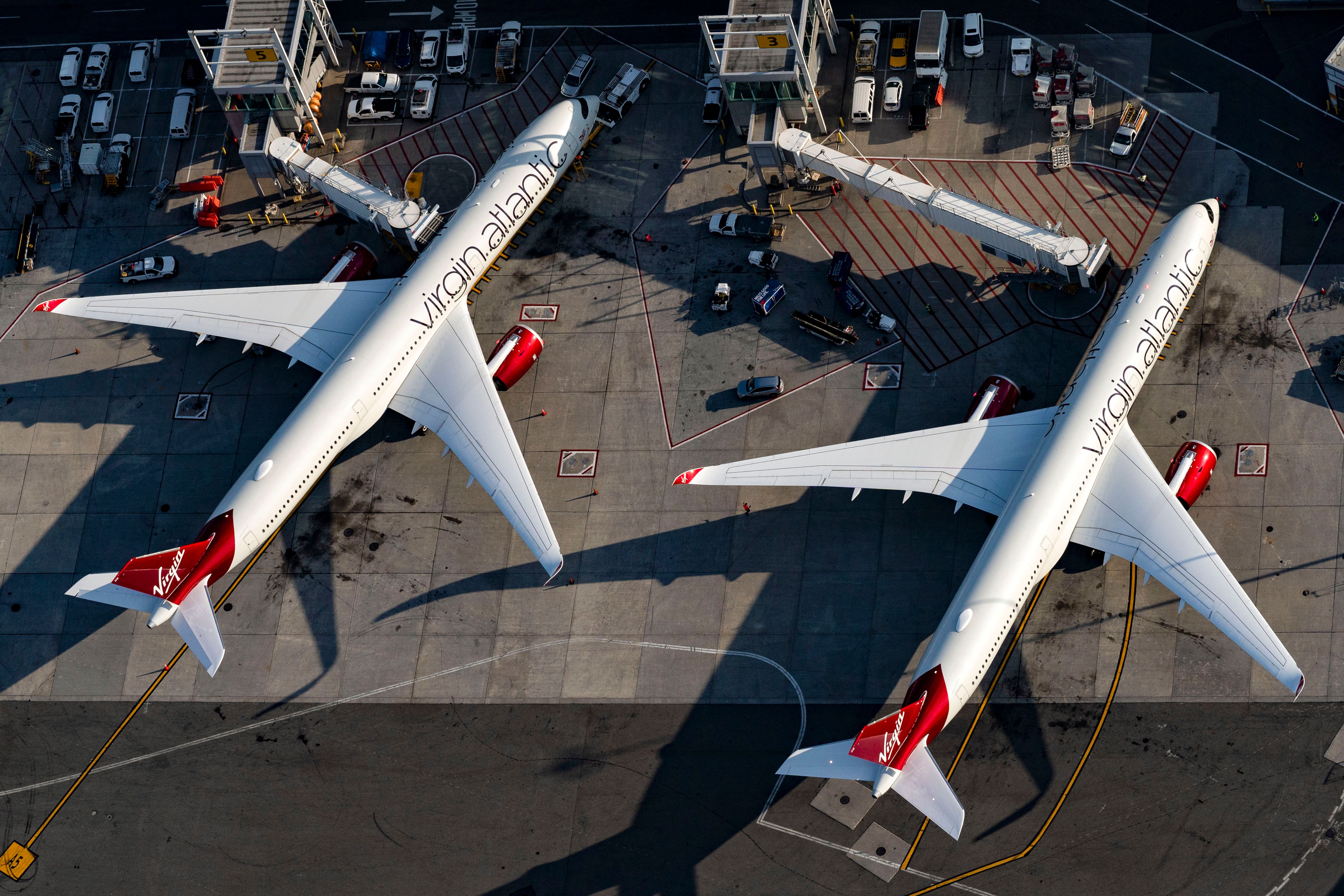 Two Virgin Atlantic Airbus A350s parked at adjacent airport gates.