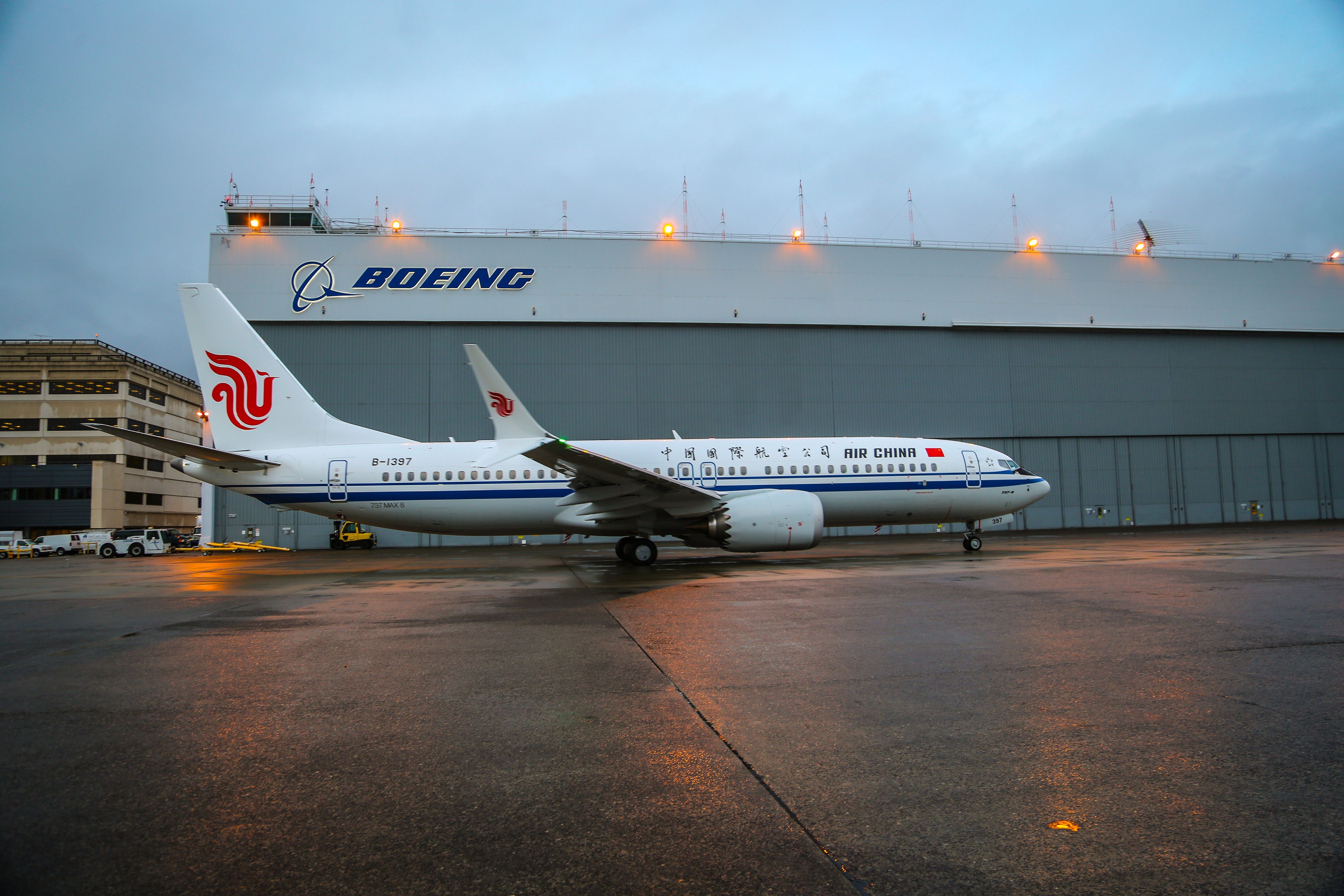 An Air China Boeing 737 MAX 8 parked on an airport apron.