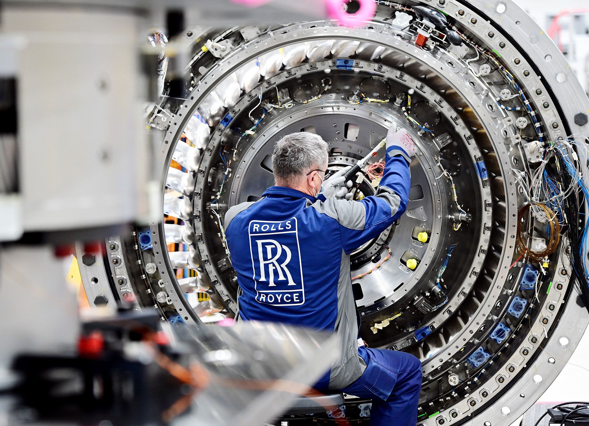 A Rolls-Royce engineer working on an UltraFan engine gearbox.