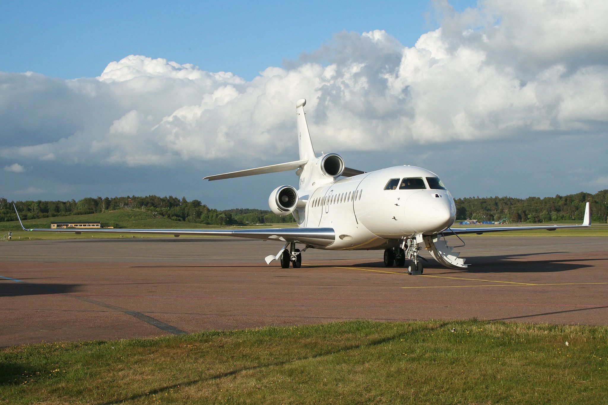 A Dassault Falcon 7X parked at an airfield.