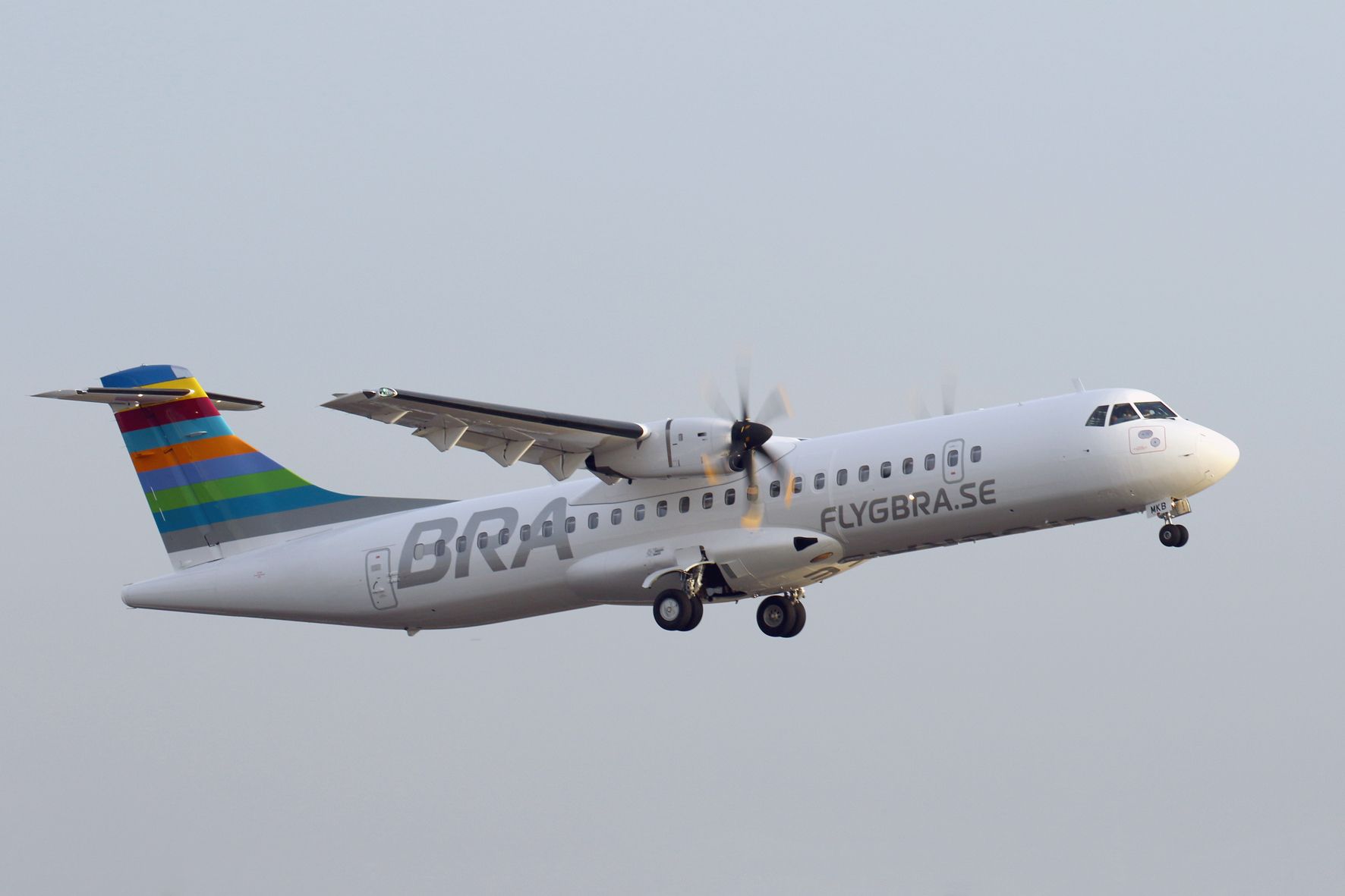 Braathens ATR 72-600 taking off against grey skies