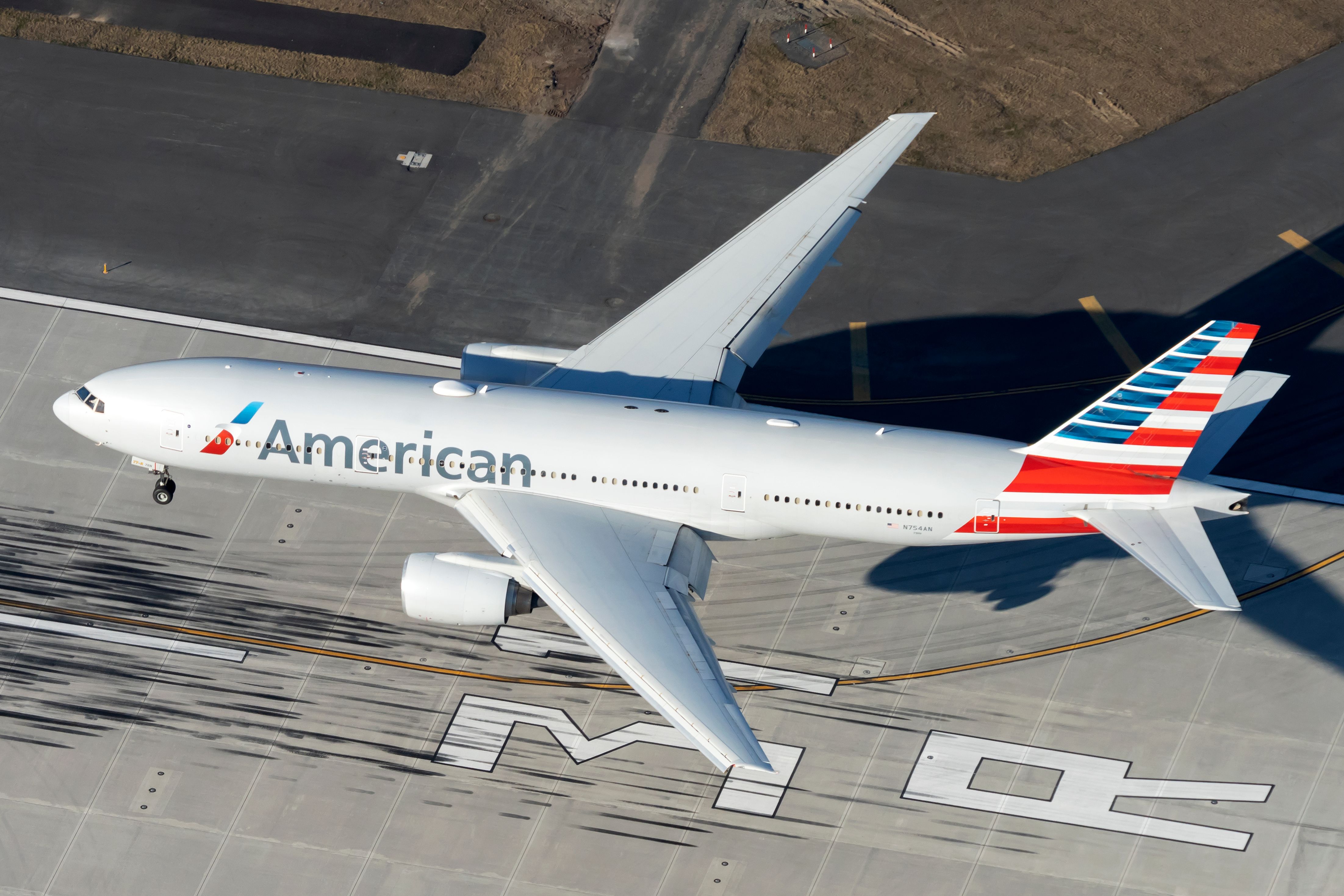An American Airlines Boeing 777-200 seen from above landing. 