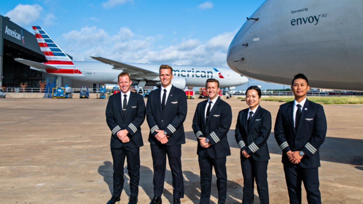 Envoy Air Pilots Posing On Apron In Front Of Aircraft