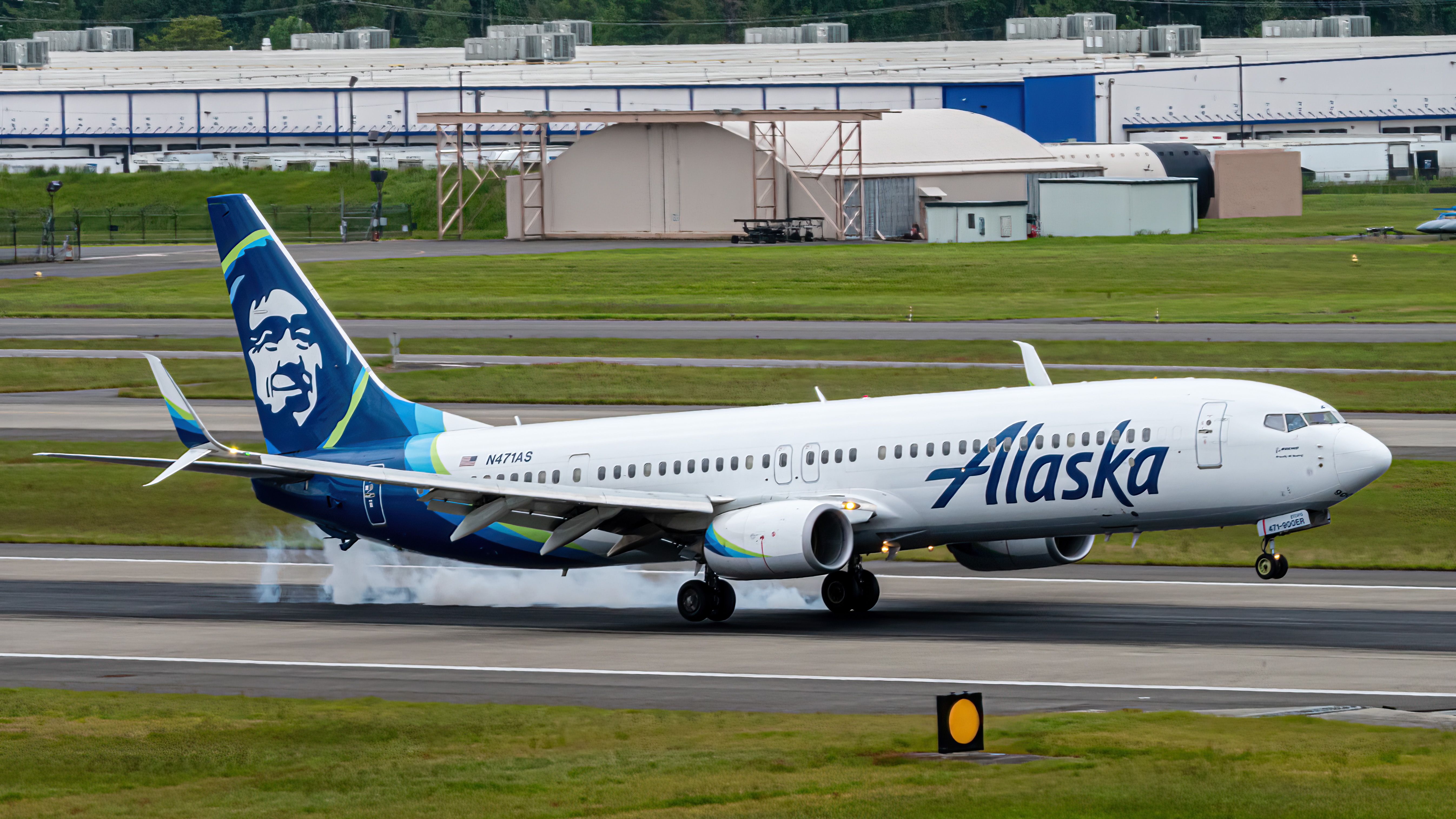 737-900ER of Alaska Airlines Smoking the Mains on a PDX Touchdown - Complete With Smoking Tires