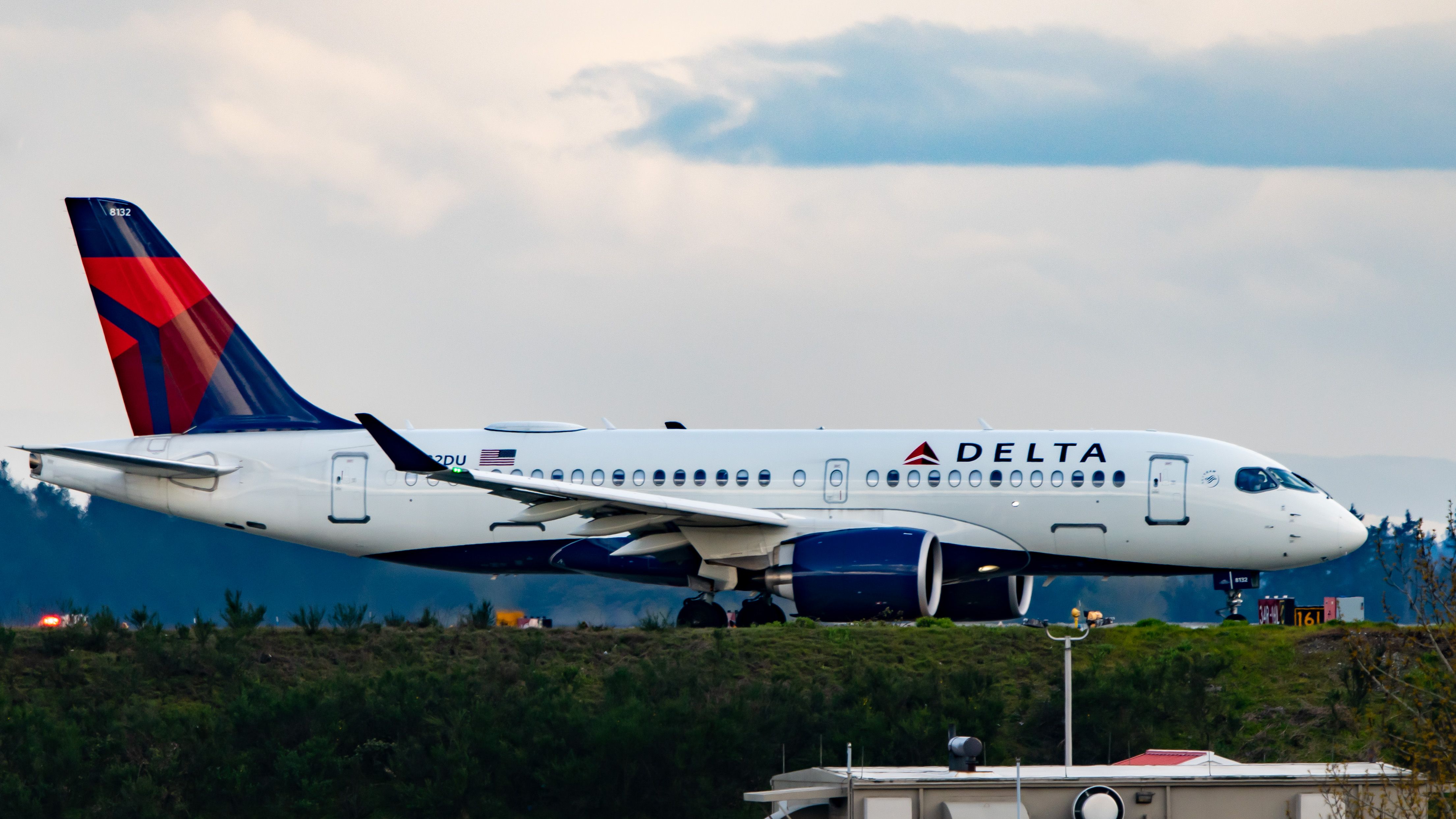An Airbus A220-100 of Delta Air Lines About to Turn Onto the Active KSEA Runway