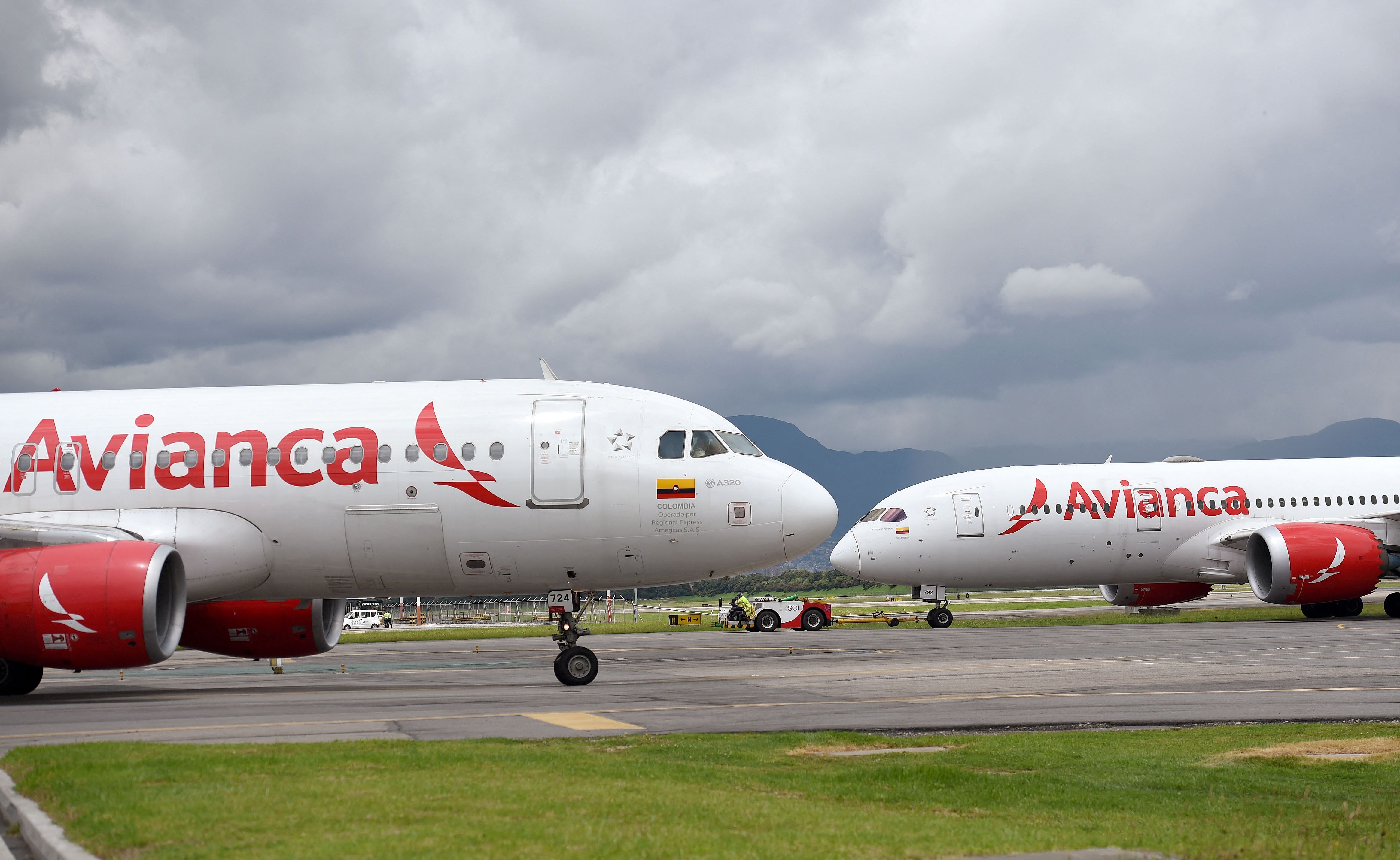 Two Avianca aircraft, an Airbus A320 and a Boeing 787 parked in Bogota. 
