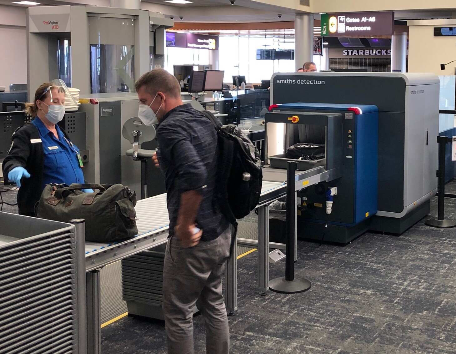 Passenger Passing Through a TSA Checkpoint