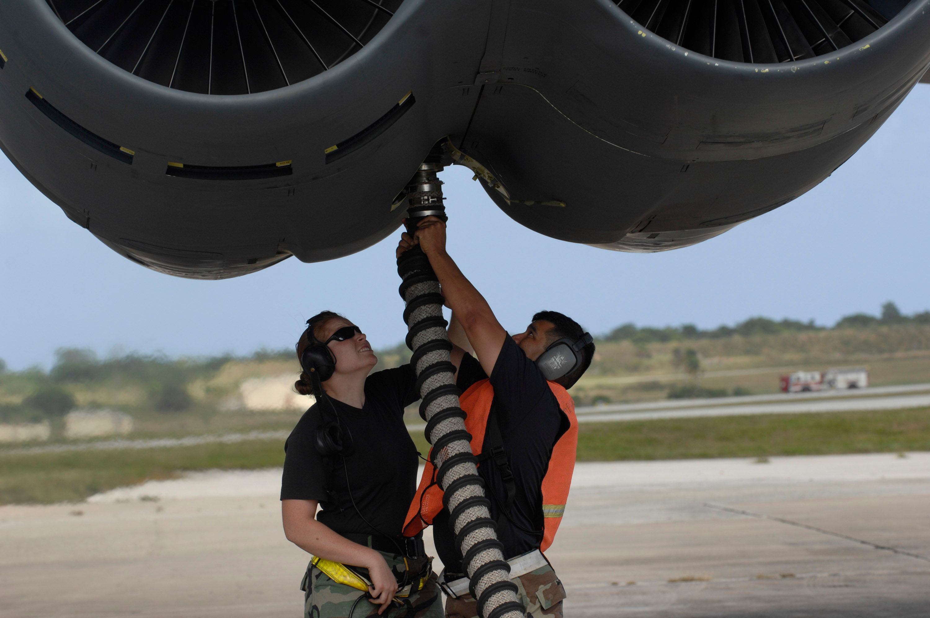 A B-52 bomber crew hooking up the an air starter to get the engines started