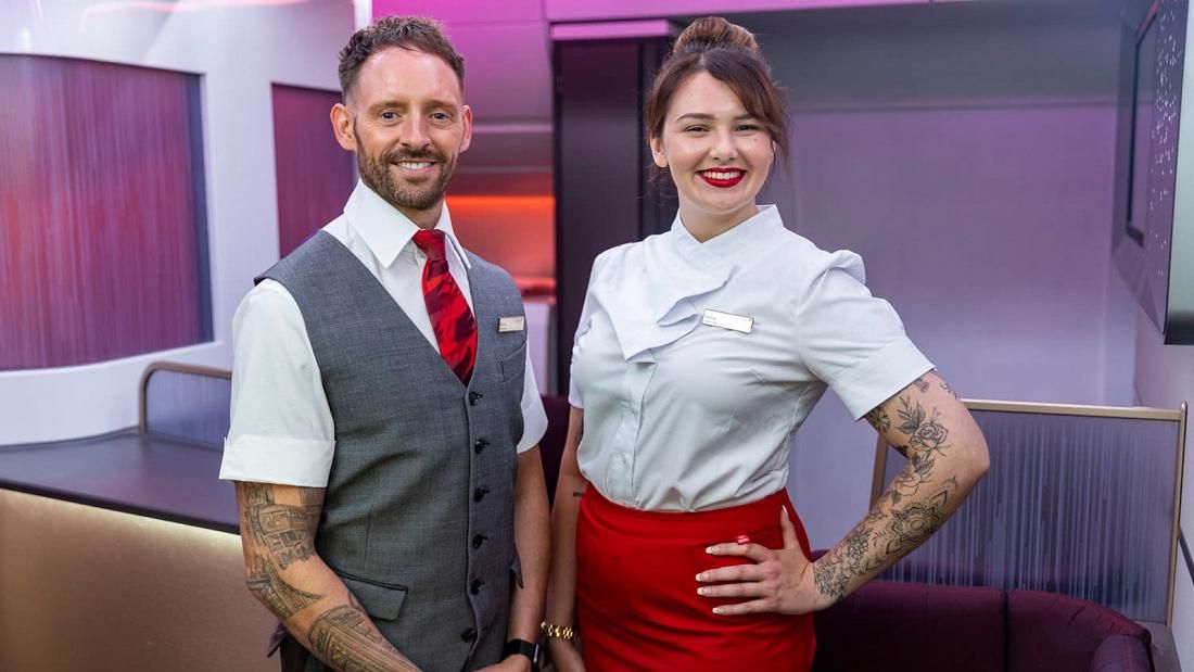 Virgin Atlantic cabin crew with visible tattoos.
