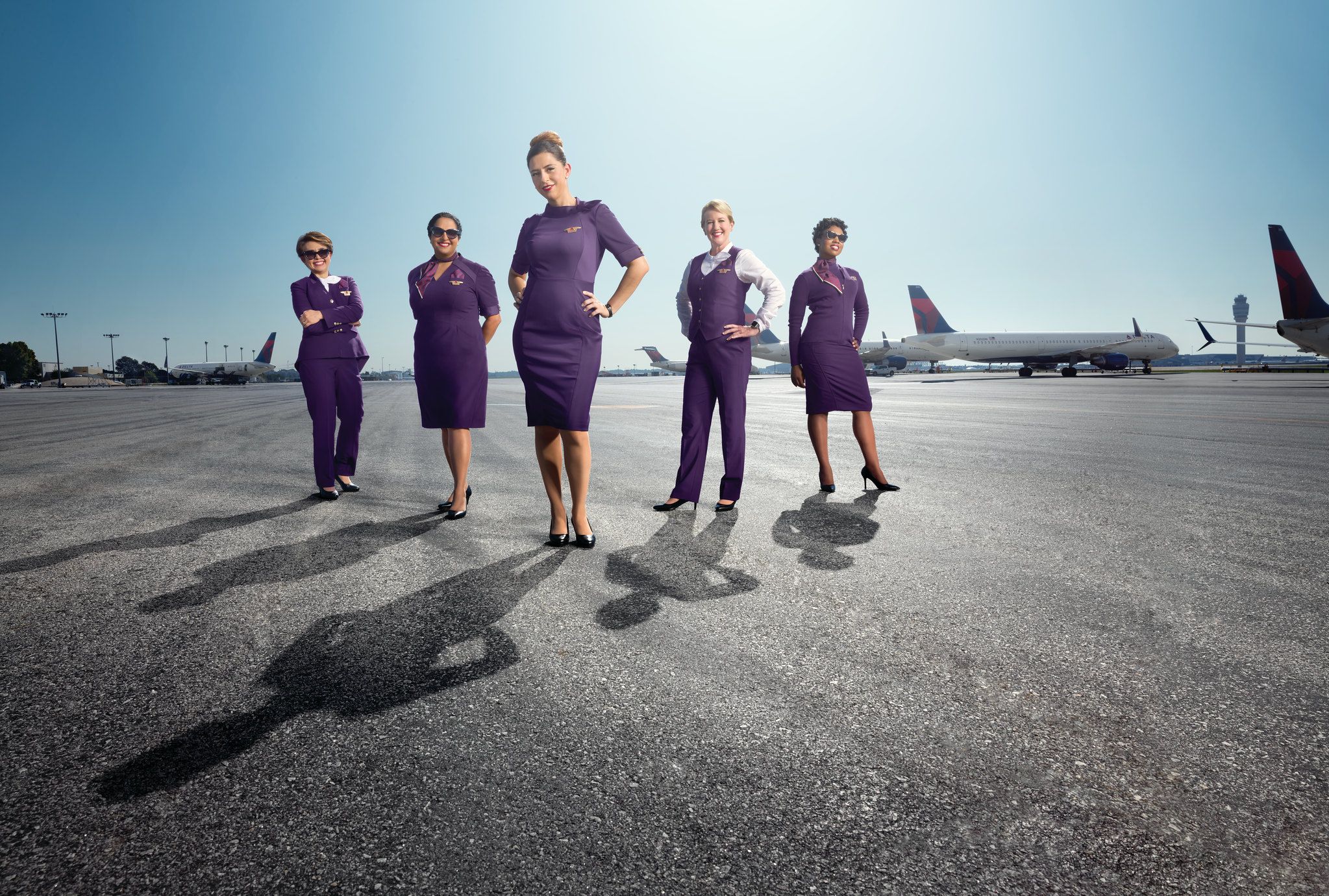 Delta Flight Attendants in Uniform on A Hot Tarmac With Delta Air Lines Jets