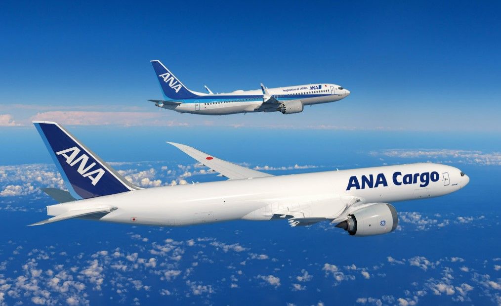Render of two ANA Boeing 777-8Fs flying above the clouds.