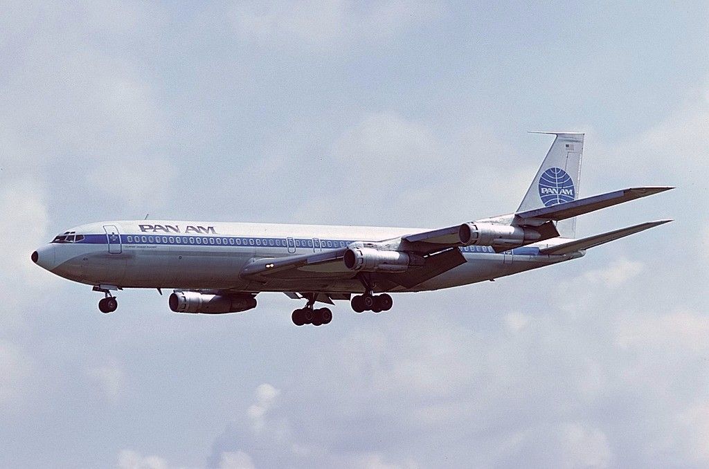 A Pan Am Boeing 707-321B flying in the sky.