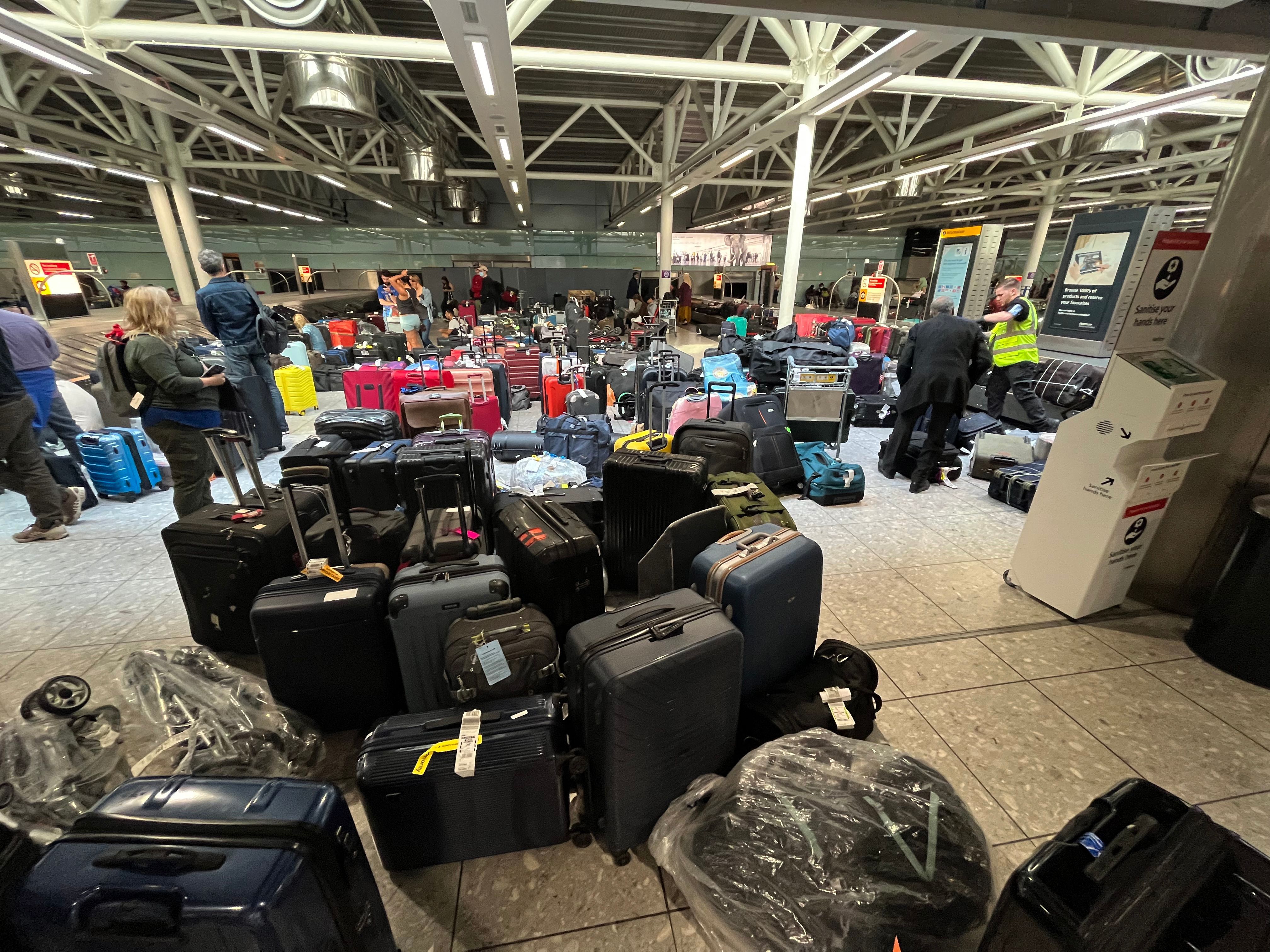 Suitcases are seen uncollected at Heathrow's Terminal Three bagage reclaim, west of London on July 8, 2022