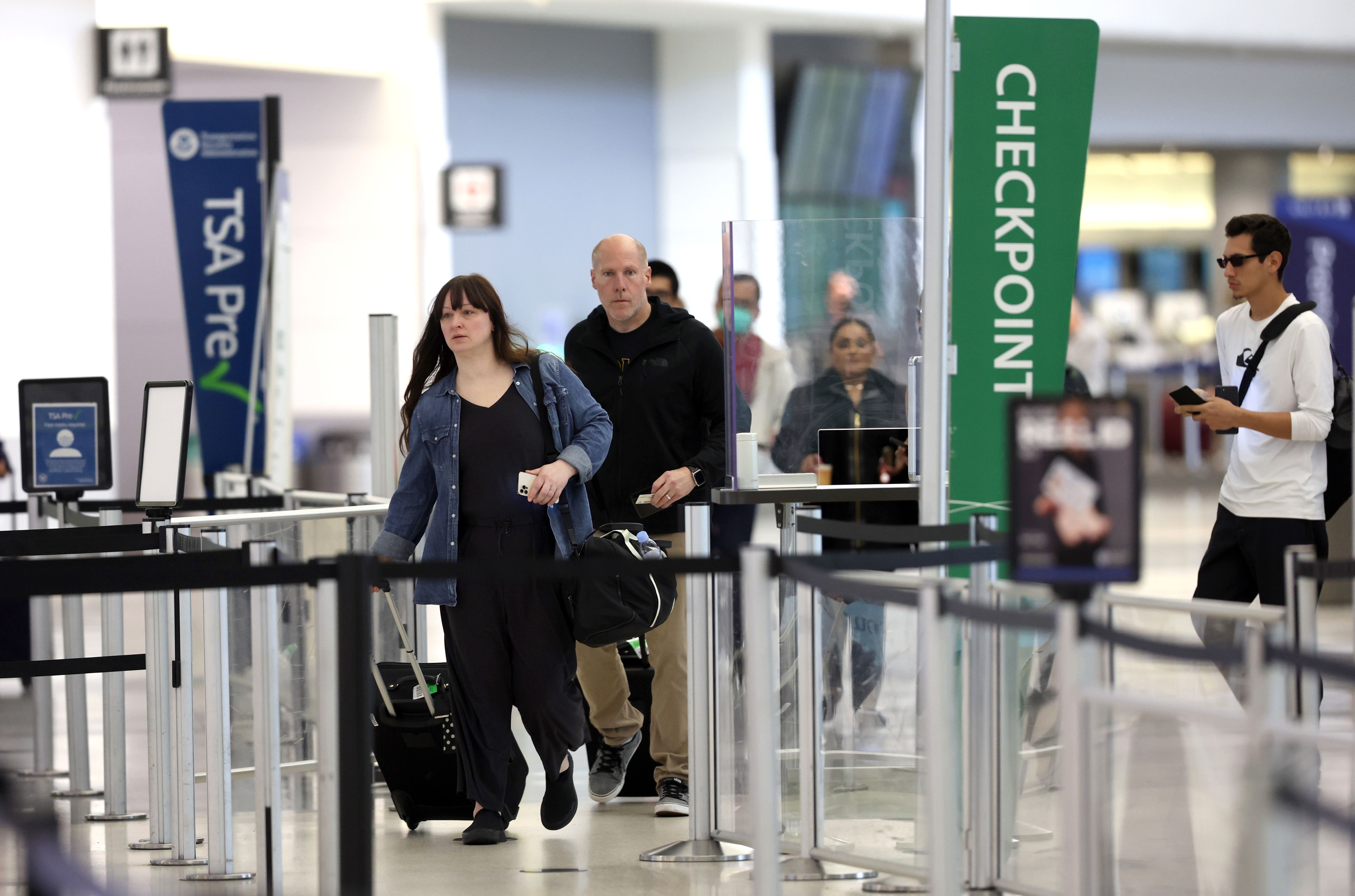 Passengers Passing Through a TSA Checkpoint San Francisco Airport July 2022