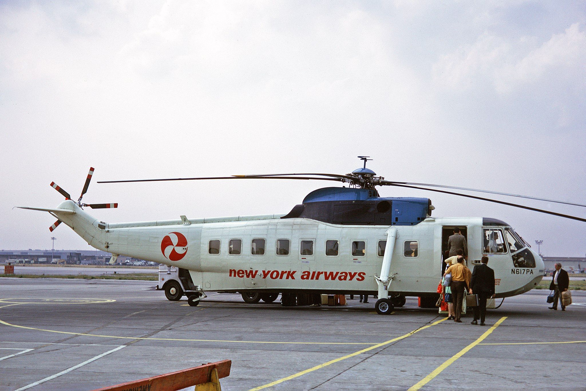 Passengers board a New York Airways Sikorsky S-61 helicopter