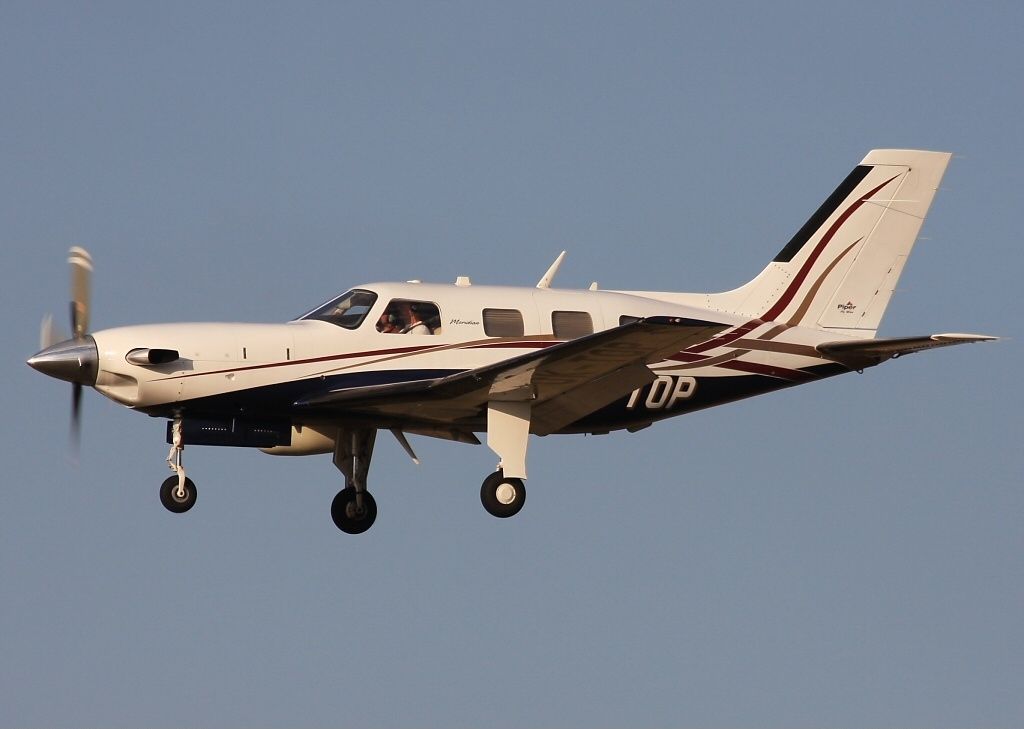 A Piper PA-46-500TP Flying in the sky.
