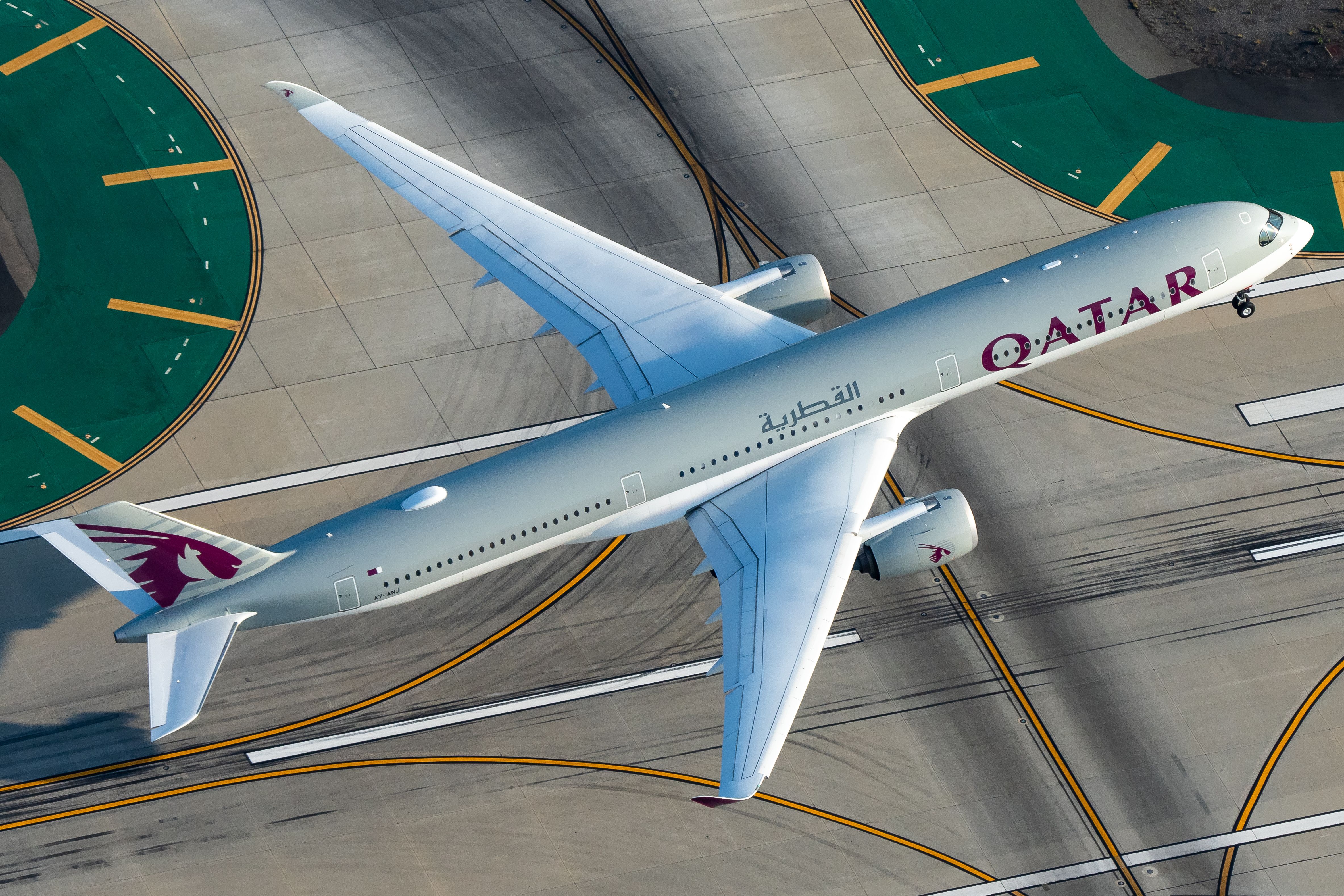 A Qatar Airways Airbus A350 aircraft departing.