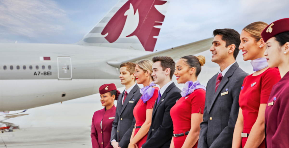 Virgin Australia and Qatar Airways Flight Attendants standing side by side.