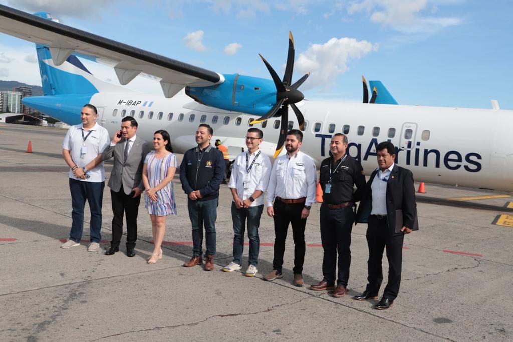 TAG Airlines executives in front of the airline's new ATR 72-500 aircraft. 