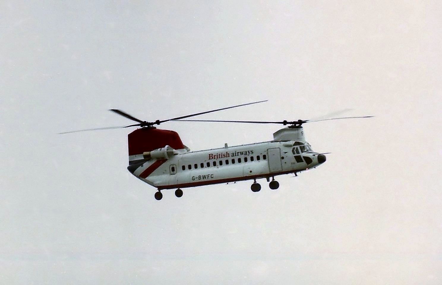 A British Airways Helicopter flying in the sky.