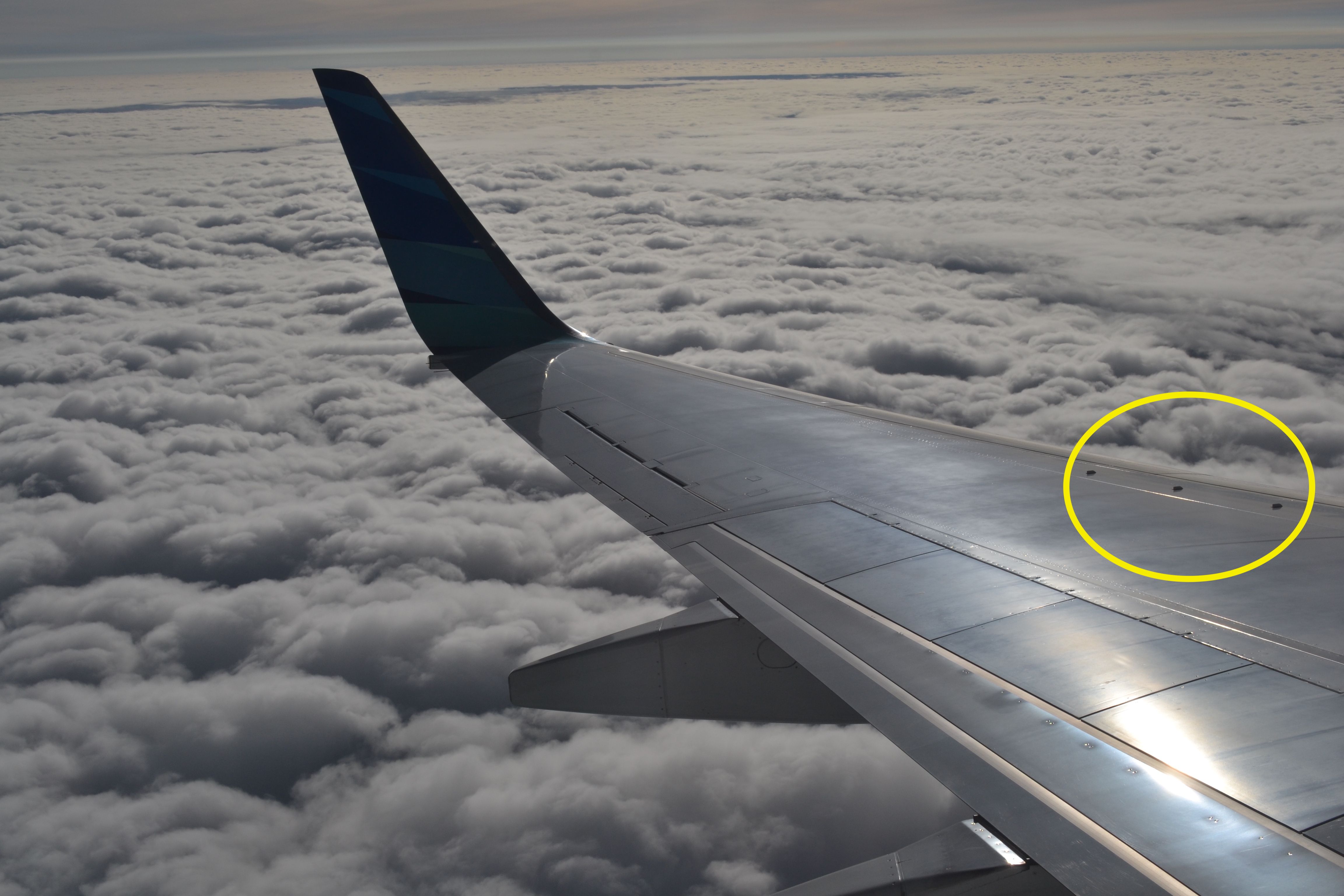 The wing of a Garuda Indonesia 737 in the sky