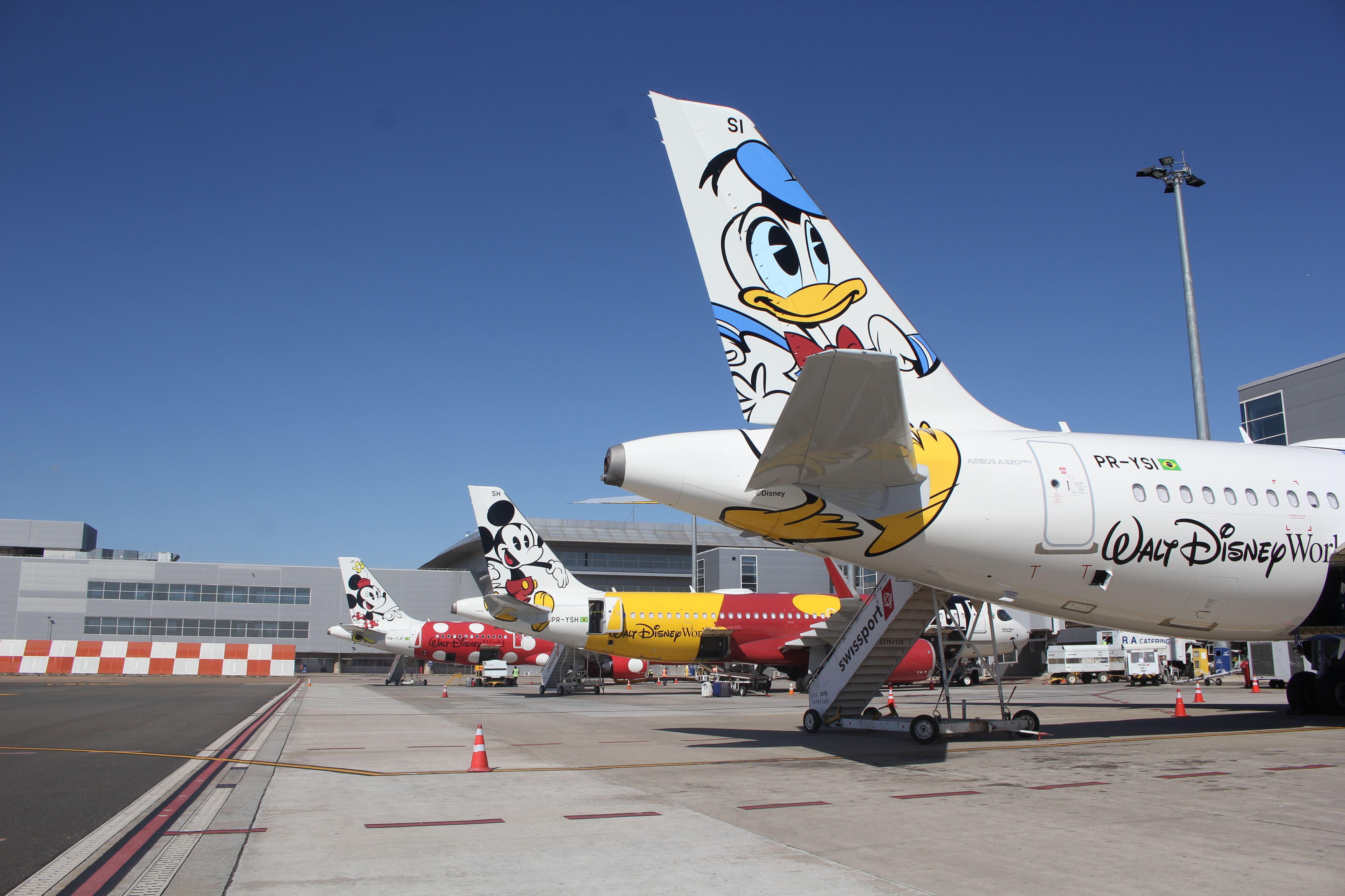 Three Airbus aircraft with a Disney-related livery. They fly with Azul