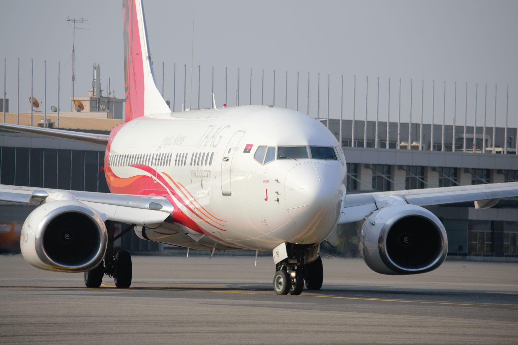 TAAG Angola Airlines Boeing 737 taxiing at airport