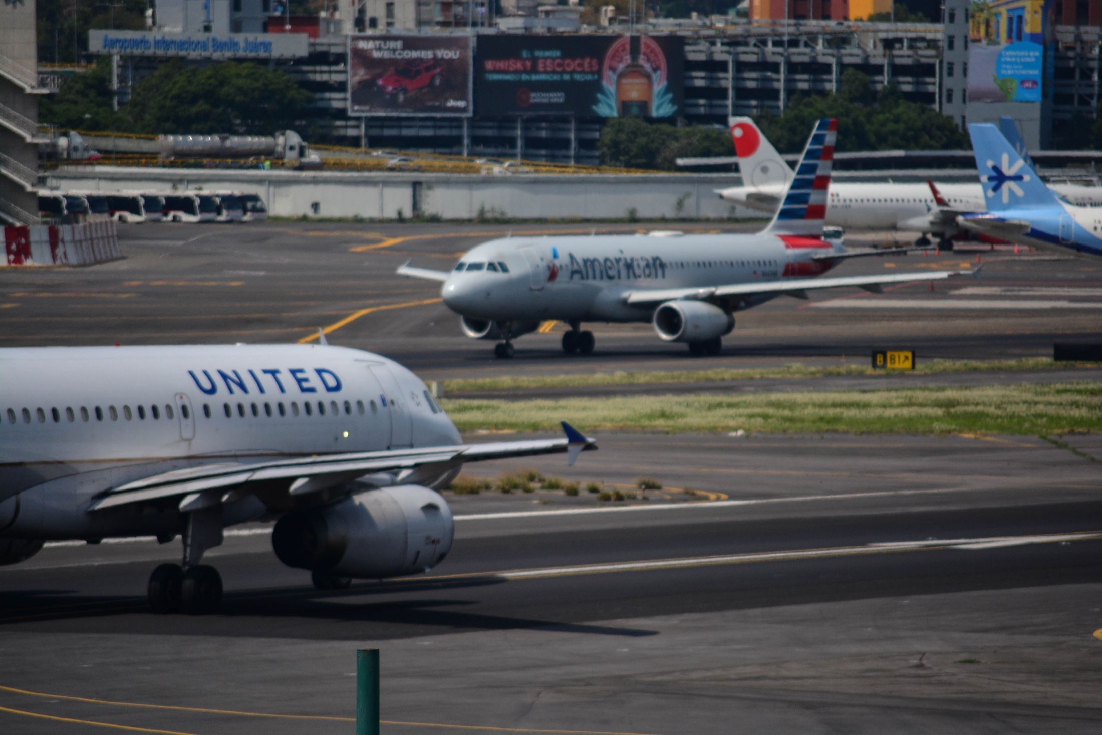 United and American Airlines aircraft on an airport apron.