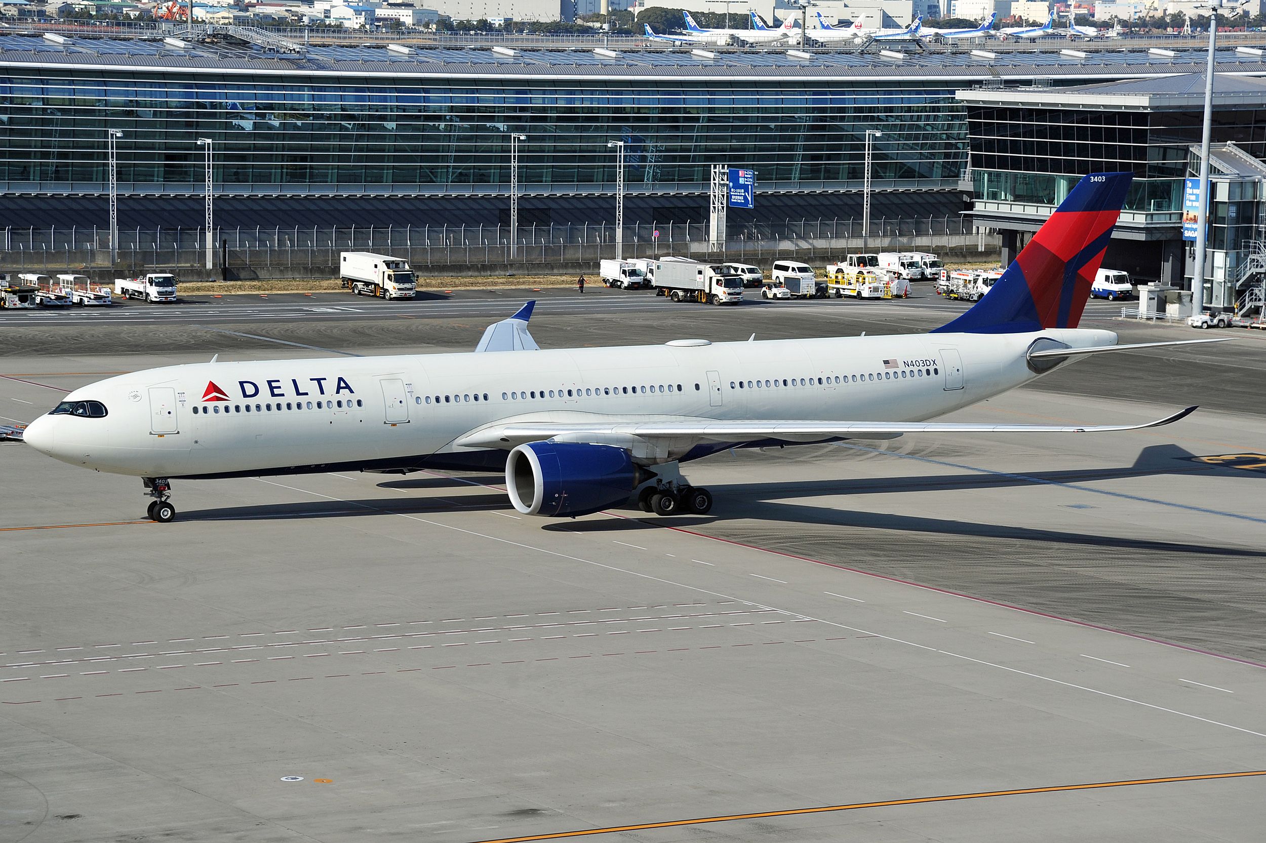 A Delta Air Lines Airbus A330-900 on an airport apron.