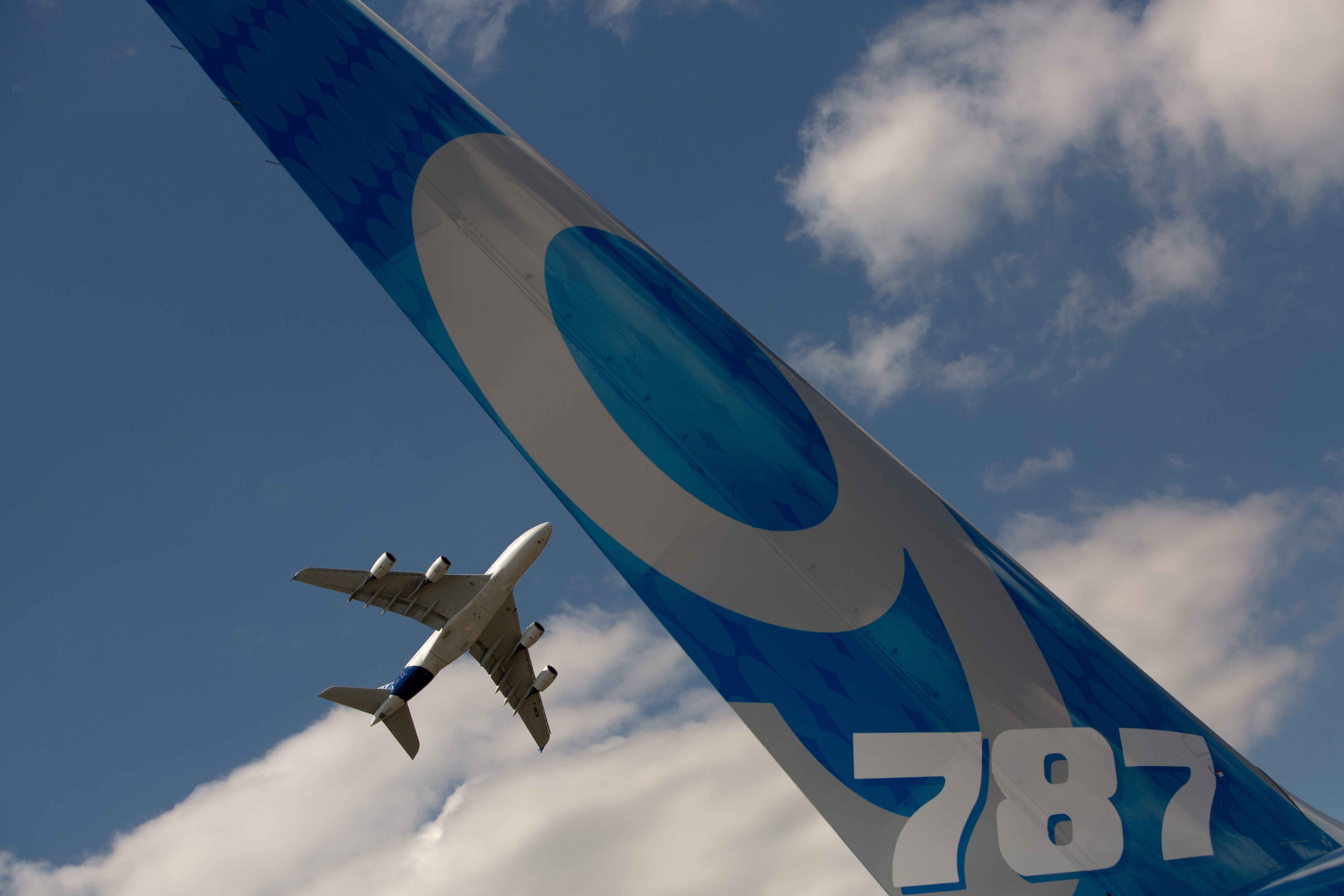 Airbus A380 flies over Boeing 787-9 airplane at the Farnborough Airshow-2014
