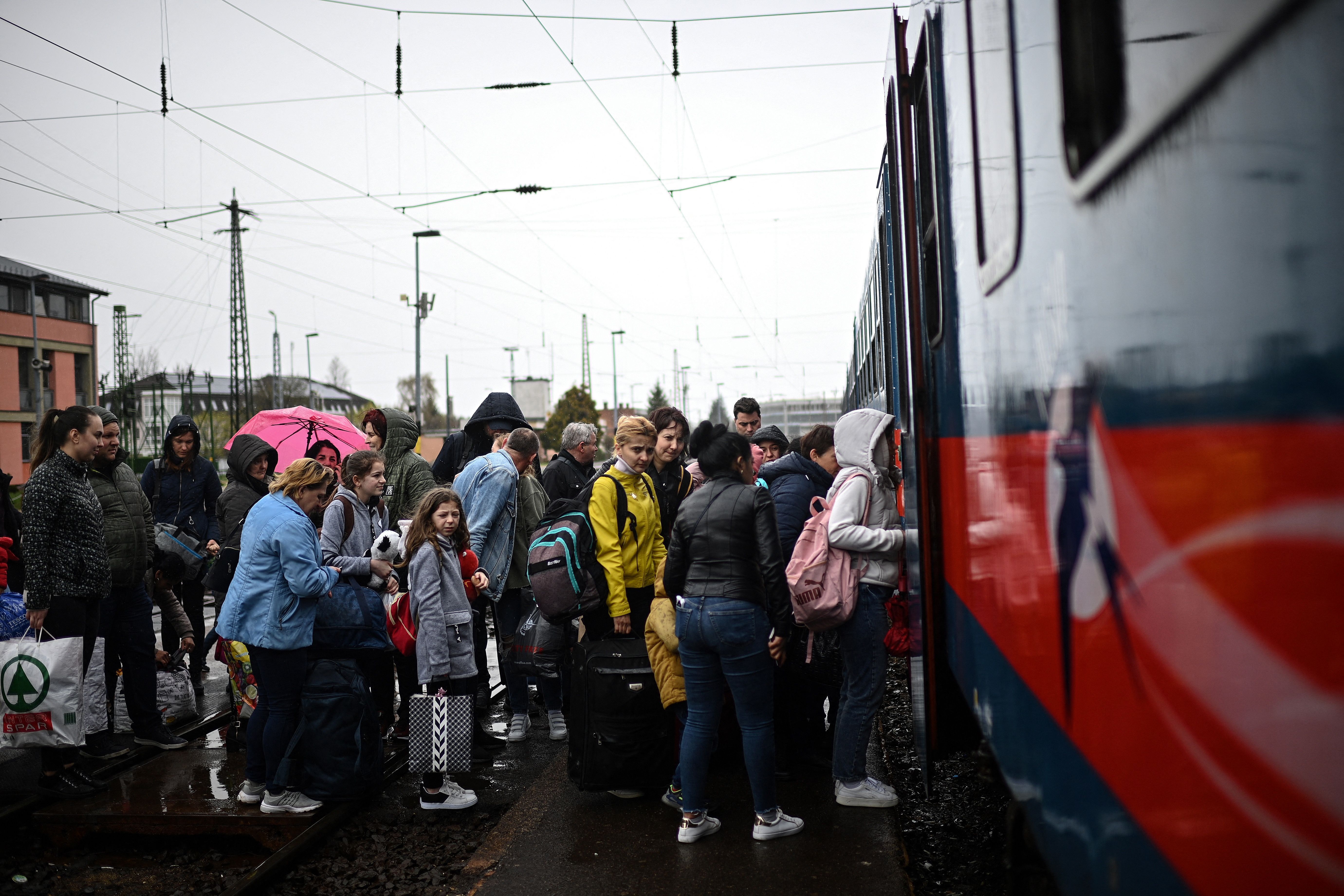 Ukrainian refugees boarding a train