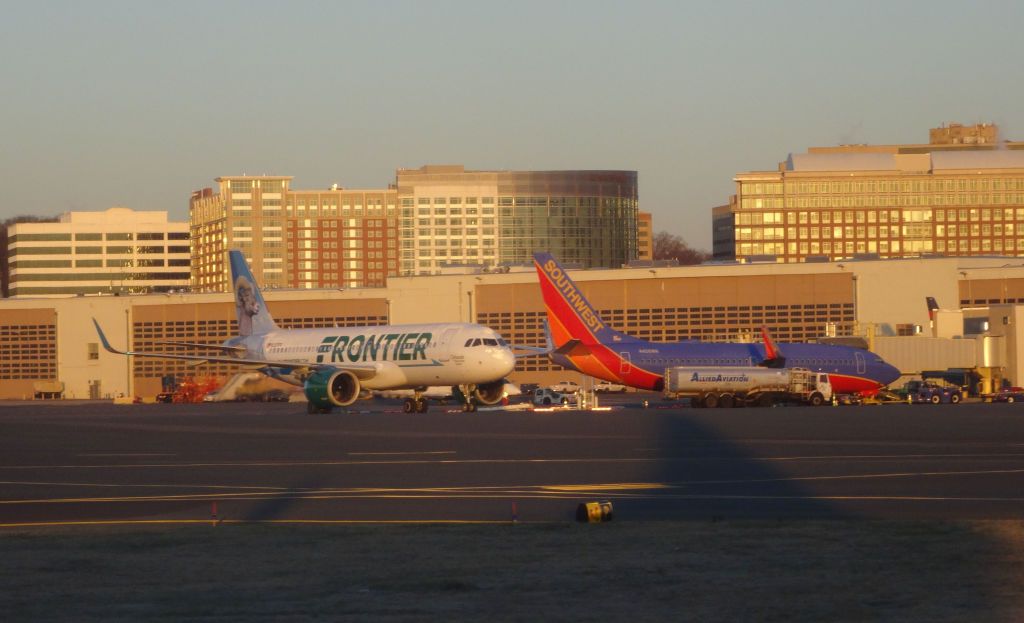 Frontier Southwest Airlines aircraft in front of terminal building