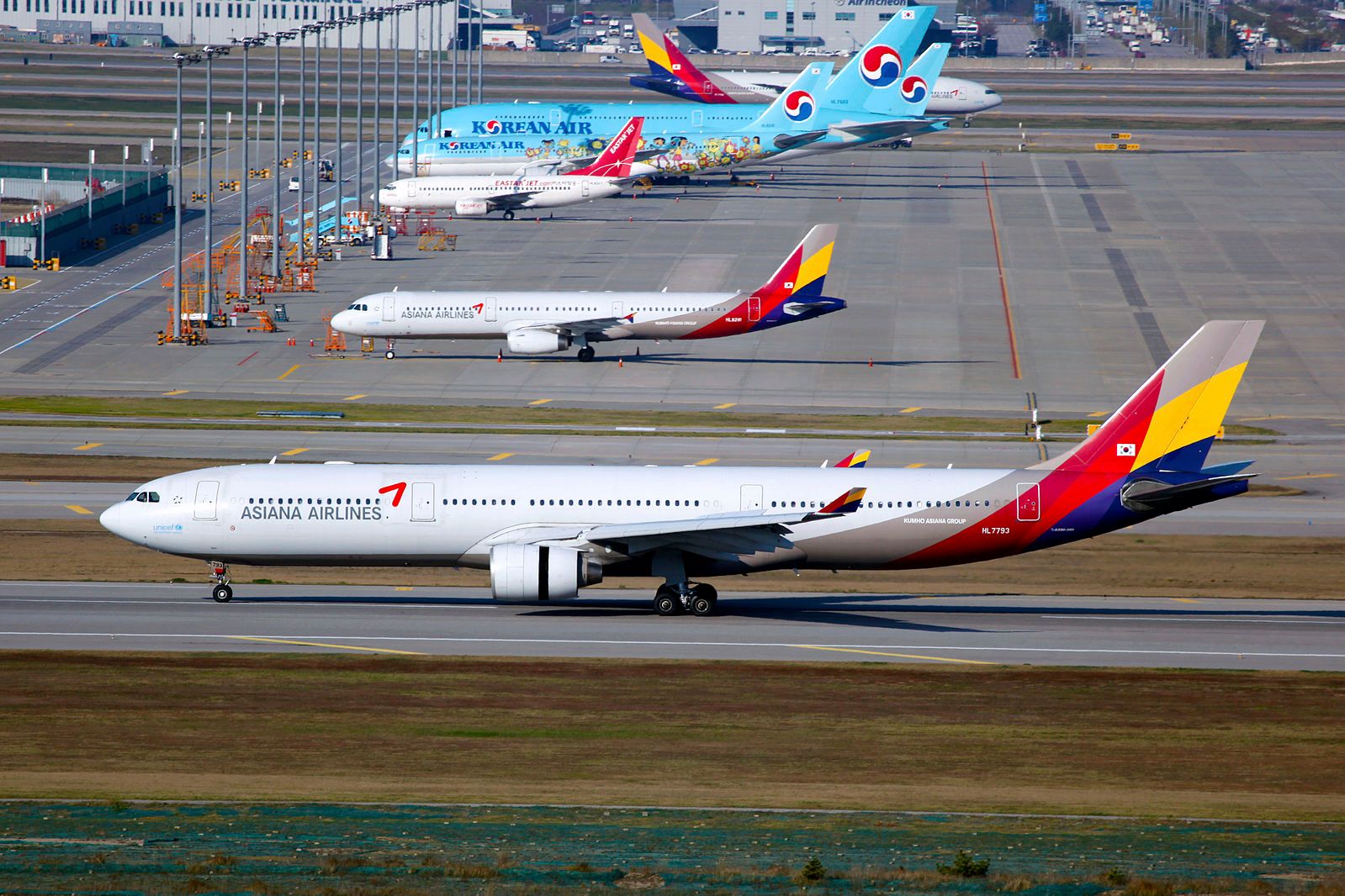 Asiana and Korean Air jets parked on airport apron